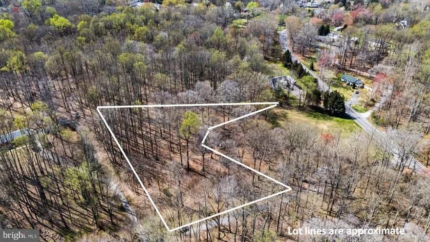 Exceptional opportunity to build your dream home on nearly 2 acres in Lothian. This buildable lot at 1003 Mt Zion Marlboro Rd offers a rare combination of privacy and convenience. Variance obtained to remove open space zoning, grading permit is approved and in hand and perched for up to 2500 sqft - all the major obstacles have already been taken care of for you. Current access off Sollers Ln. Bring your vision and builder—this is a ready-to-go homesite in a desirable location.