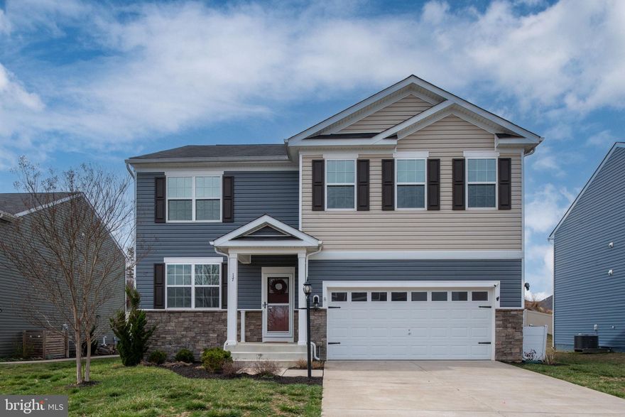 Welcome Home! This immaculate one-owner home is nestled in the sought-after Southgate neighborhood of Fredericksburg! This stunning 5 Bedroom, 3 bath property is in a double could-e-sac and ready to invite its next chapter to you. Built in 2021, this contemporary style home offers plenty of thoughtfully designed living space that's bright and inviting. From the moment you step inside, you will feel the care of this lovely, well maintained home with tasteful details throughout.
As you enter, there is a versatile room that can be used for a recreational area or an office space.  Beautiful LVP flooring flows through the foyer, living room, dining and eat in kitchen, creating a warm and inviting ambiance. The kitchen is a chef’s delight, featuring upgraded white cabinets, granite countertops, an oversized island, stainless steel appliances and a huge pantry. Also on the main level, you’ll find a spacious carpeted bedroom with a full Bath—ideal for guests or even a private retreat for an older child. Upstairs, you will find 4 additional generous size carpeted bedrooms, and another full hall bath, along with an adorable recreational nook that's perfect for a playroom or library. The luxurious owner’s suite showcases granite dual sinks vanity, with a walk in shower and a fabulous walk in closet. For added convenience, the laundry room is located on the upper level.
The finished basement adds even more flexibility to this home for entertainment and lots of storage space. As you step outside and discover the charm of your fully fenced in backyard with a stamped concrete patio that's perfect for everything from weekend barbecues to quiet mornings with coffee. 
With impeccable craftsmanship, and an ideal location near VRE stations, with convenient I-95 access for effortless commuting, shopping, dining, and the historic charm of Fredericksburg, this home is ready to meet all your needs. Southgate is the perfect place to call home with a community playground around the corner. This isn’t just a house; it’s the start of your story. Don’t let this opportunity slip away—schedule your showing today and see how it feels to come home.