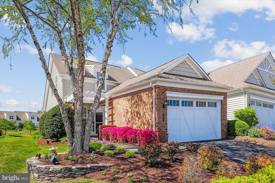 You will be so delighted and find a big smile on your face when you see the beautiful landscaping! Enjoy all the vibrant colors from your front slate patio to your backyard paver patio with sitting wall. Welcome home to this 3 bedroom 2.5 bath home. What a great time to find your new home and enjoy all Potomac Green has to offer.  Kitchen features gas cooking, granite countertops, backsplash, pantry and breakfast bar.  Spacious open living room with vaulted ceiling, gas log fireplace, sliding glass door to patio with beautiful views of backyard and open space beyond. Dining room great for guests or intimate dining. Floorplan is open so you have the wonderful views whether dining or relaxing in the living room. King size primary bedroom offers a walk-in closet, bath with double bowl vanity, walk-in shower and linen closet. Main level laundry room with laundry sink, wall cabinets, shelving and washer and dryer convey. 
On the upper level you will find a loft, great for relaxing, watching TV,  playing  games or an office, whatever you need. The loft is a nice, bright open space overlooking the living room. Both bedrooms on the upper level are spacious, the front bedroom has a walk-in closet. HVAC room features extra storage space. The carpet on the stairs and upper level was replaced last year.
Two car garage provides some shelving for extra storage.
You will be glad you found this lovely comfortable home, offering everything on your list,  ready for you to begin your next adventure!