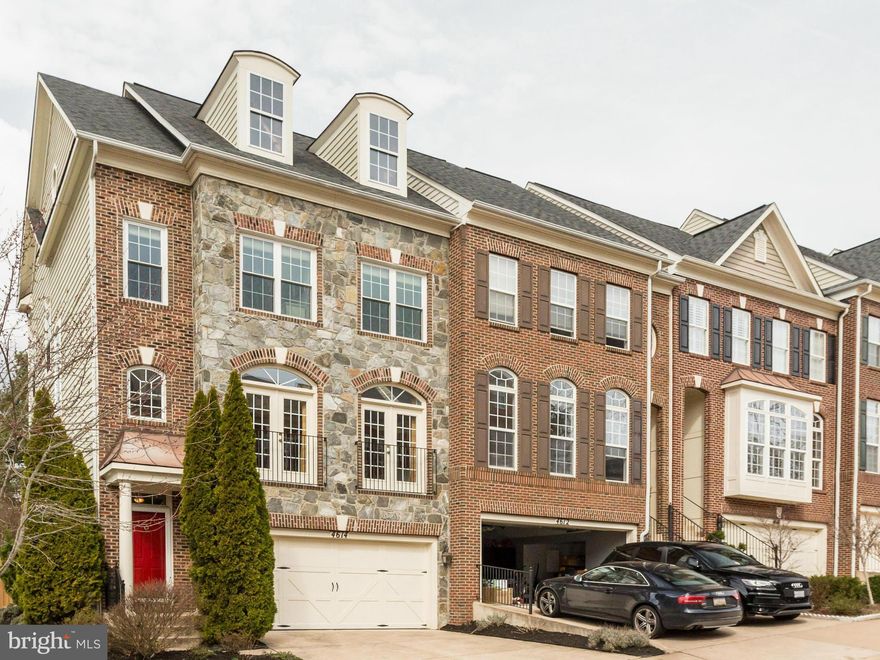 RARELY AVAILABLE!!! Stunning three level stone front, end unit townhome situated on a beautiful private lot, backing to trees! 2 car garage, gorgeous gourmet kitchen with upgraded cherry cabinets that leads to huge custom maintenance-free deck. Hardwood floors throughout main level, custom built-ins and 9' ceilings! Loaded with many more upgrades! An absolute MUST SEE!!!