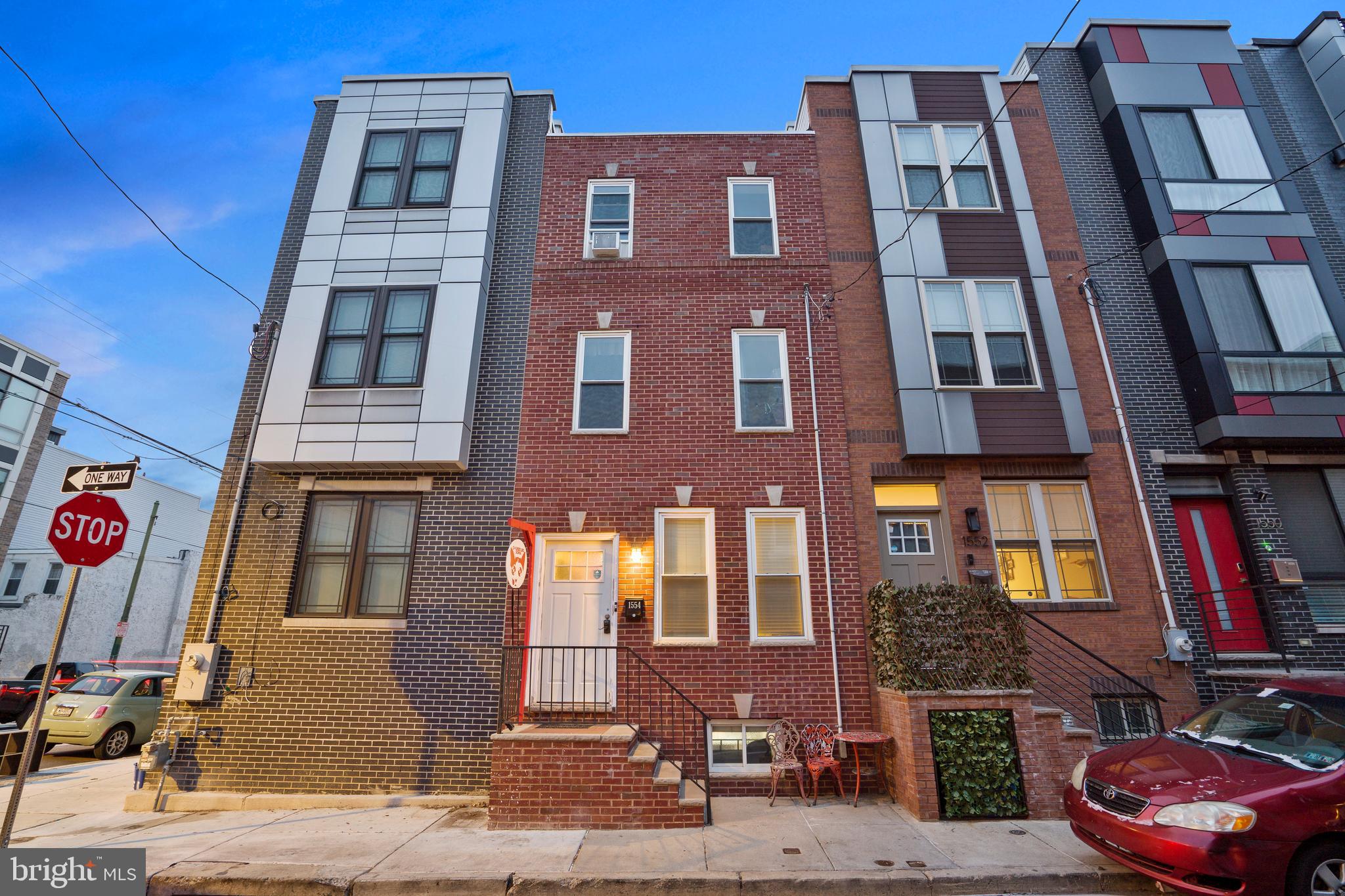 Welcome to 1554 S Lambert St — freshly painted, move-in ready, and ideally situated in the heart of Point Breeze. This 4-bedroom, 2.5-bath home offers exceptional craftsmanship, modern upgrades, and a flexible layout perfect for today’s lifestyle. With a brand-new roof (2024) and fresh interior updates, all the hard work has been done for you.
The open-concept main level is warm and inviting, featuring hardwood floors, crown molding, and seamless flow from the living room to the dining area and kitchen. The chef’s kitchen is a standout, boasting ceiling-height shaker cabinets, butcher block countertops, Montauk blue slate tile flooring, and stainless steel appliances. Step outside to a private, fenced backyard—ideal for grilling, relaxing, or entertaining.
Upstairs, the second floor offers two spacious bedrooms, a stylish full bath, and a recently added fourth bedroom—perfect for a guest room, office, or nursery. The third-floor primary suite is a true retreat with a walk-in closet, freestanding soaking tub, and separate tiled shower.
The finished basement provides even more flexible living space, including a half bath and dedicated storage—ideal for a home gym, media room, or play area.
Additional features include newer windows, a Nest thermostat, LED lighting, and a central location that puts you just steps from Sprouts Farmers Market, Wharton Square Park, Philly Tacos, Two Eagles Café, Washington Ave, Center City, and public transit.
TO TOP IT ALL OFF, A PREFERRED LENDER IS OFFERING A COMPETITIVE INTEREST RATE AND UP TO $6,000 IN CLOSING COST ASSISTANCE FOR BUYERS WHO MEET THE PROGRAM’S QUALIFICATIONS! Schedule your private tour today—this updated Point Breeze gem won't last!
Some photos are virtually staged.