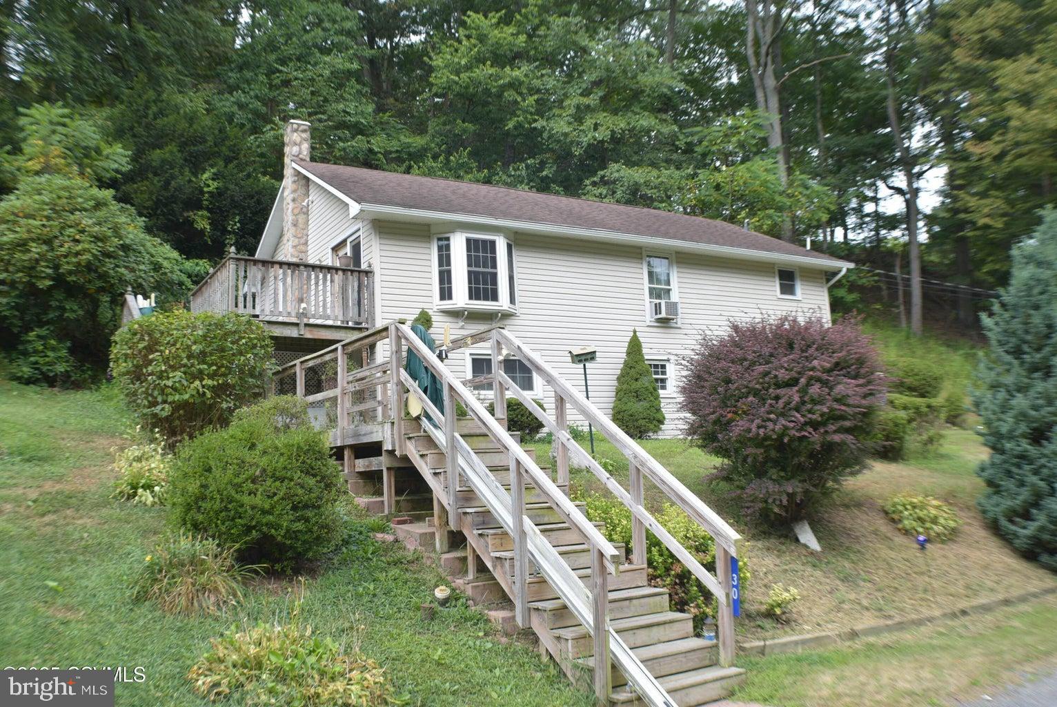 Whether you're seeking a summer retreat or year-round residence, this charming ranch may be just what you're looking for! Located minutes from town, less than 8 miles from Knoebels Amusement Park and close to state game lands, it offers both convenience and recreation. Features include a modern kitchen, a dining room with a decorative fireplace, two bedrooms, replacement windows, a relaxing deck, detached two-car garage and a storage shed. Please note: the water heater will need to be replaced. Cash or Conventional only.