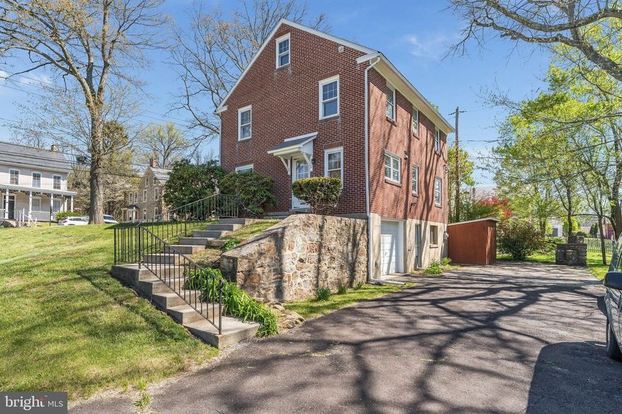 Stately Brick Colonial with Expansive Lot & Unique Opportunity

Come discover the charm and potential of this solid brick Colonial, ideally set back from the road in the quaint village of Springtown. Offering both residential comfort and village commercial zoning, this property presents a rare opportunity for flexible use.

The home welcomes you with abundant natural light and beautiful hardwood floors throughout. The main level features a spacious living room with a classic fireplace and mantle, a formal dining room, a kitchen, and a convenient powder room—perfect for everyday living and entertaining.

Upstairs, you’ll find four generously sized bedrooms and a full bath, all with continued hardwood flooring. A walk-up attic with a cedar-lined closet provides excellent storage and potential for additional living space.

The walkout basement offers even more versatility, along with direct access to the attached one-car garage.  heated garage adds further functionality—ideal for hobbyists, contractors, or extra storage.

Step outside to enjoy the expansive lot, highlighted by a gorgeous stone patio with built-in fireplace, perfect for relaxing or entertaining. Stone retaining walls add character and structure to the outdoor space, while ample off-street parking provides convenience for guests or business use.

As an added bonus, the sale includes an additional lot (Tax ID: 42-015-005), offering the potential to expand or build a garage, workshop, or other structure.