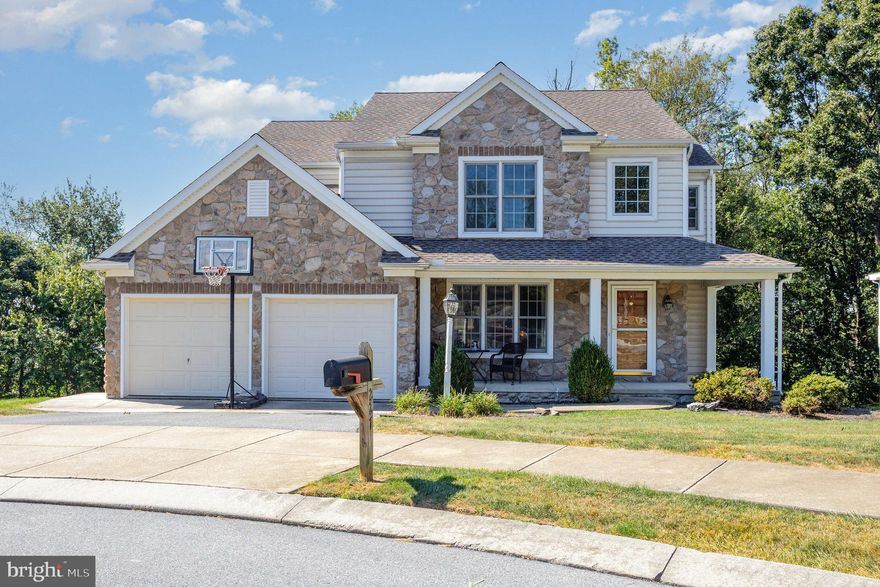 Tucked away in a quiet cul-de-sac, this beautiful 4-bedroom, 2 full and 2 half-bath home offers space, comfort, and stunning seasonal views.  Step inside to find gleaming hardwood floors and a bright, welcoming layout. The main level features a designated dining room, a spacious kitchen with island, and a large family room complete with a dual-sided gas fireplace, built-in shelving, and a large picture window that fills the space with natural light. You'll also find a convenient half bath and a laundry/mud room just off the garage for everyday ease.  Upstairs, you'll find four generously sized bedrooms, all with spacious closets and brand-new carpet. The primary suite is a true retreat, boasting a massive walk-in closet and a gorgeous, newly renovated en-suite bathroom that is sure to impress.  The fully finished basement offers even more living space with new carpet and plenty of room for a media area, playroom, home gym, or office -whatever suits your lifestyle.  Out back, enjoy the seasons from the covered composite deck, complete with a ceiling fan - perfect for relaxing or entertaining while enjoying peaceful farmland views in the Fall and Winter.  Additional updates include fresh paint and a new roof (2018) for added peace of mind.  Don't miss your chance to own this move-in ready gem in a fantastic location!