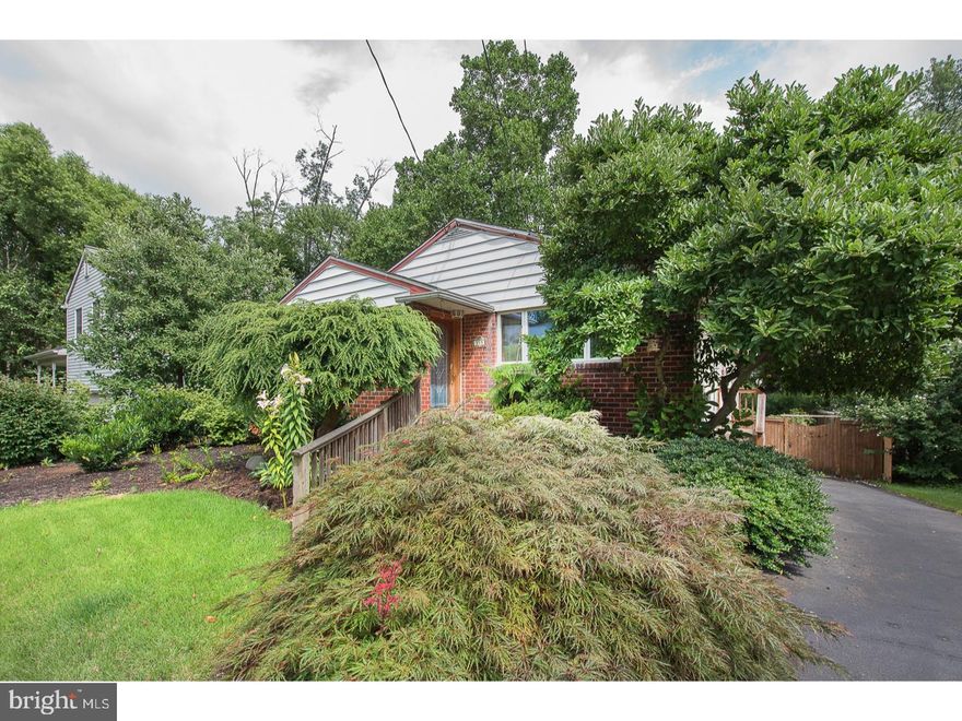 Enjoy this spacious ranch with full finished basement not included in the square footage! Charm abounds this bright and cheery home. Large living room with a great open feel, beautiful stained glass door and large front window. Spacious dining room with large windows opens into the remodeled kitchen. Handsome wood cabinets, corian countertops, tiled backsplash, stainless steel appliances and tiled floor. A great place to cook and gather around to enjoy. A cook's delight! The Master bedroom has a beautiful deck accessed thru sliding doors with breaktaking views of the rear yard and master bath with stall shower. Additional hall bath and two additional spacious bedrooms with good closet space. There is also a walk up attack for additional storage. First floor features nice hardwood floors throughout. Lower level is finished with another bedroom/office area, spacious living space with wood burning fireplace, tiled floor, powder room, laundry room and sliders to rear yard. Lots of extra living space and flexibility. Step out into your dream backyard! A nice wood deck, beautifully landscaped with a Pond, perennial plantings and built for relation! This home is conveniently located to area Hospitals, Universities and Train Station. A short commute to Center City, 476 and Turnpike. Award Winning Abington Schools make this home a must see!  1 Year Home Warranty Included.