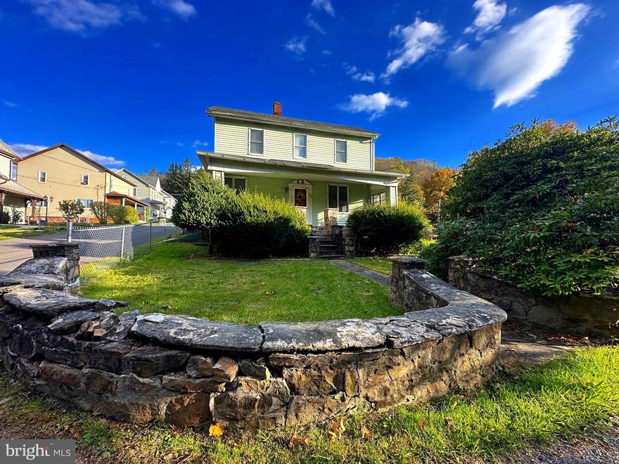 Nestled in the peaceful mountains of Western Maryland, this charming 3-bedroom 2.5 bath home has been filled with love for many years and is ready to welcome its next family.  Step inside and you will find the cozy charm of original hardwood floors in the living and dining rooms, perfect for family gatherings or quiet evenings. The kitchen offers ample counter space for baking and meal prep, along with a pantry for extra storage. A convenient main-level half bath, mudroom and laundry area - everything right where you need it.
Upstairs you will find three spacious bedrooms, along with an extra room that's perfect for a home office or walk in closet. The primary bedroom includes its own full bath, two closets, and a built in reading bench
Outside, you will love the fenced backyard for kids and pets, off-street parking and a sunny deck for entertaining or relaxing.