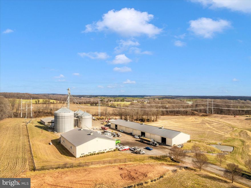 Agricultural grain storage facility, large buildings, insulated and heated shop, truck scales, three phase power, and more on almost 80 acres of prime farmland!  EQUIPMENT STORAGE BUILDING: 300' x 70'. 15 doors that are 16’5” tall.  Center partition and electric.  SHOP: 120’ x 85’ with 20’ ceilings. 4 large overhead doors. Door 1 & 2: 26’ wide x 16’ tall. Door 3&4: 16’ wide x 14’ tall. 2 man doors. 2 commercial-sized exhaust fans. Overhead LED lighting. Fully Insulated with heated concrete floor. Propane heater is 1+/- year old. Commercial 2-ton crane with 9 yards of concrete anchoring. 4 tool/storage bays. Office 15’ x 11’4”. COMMODITY STORAGE BUILDING: 100’ x 41’. Concrete Walls. 5 Bays. GRAIN STORAGE FACILITY:  Dryer: 40’ 5-year-old Superb Energy 6Q series dryer by Brock. Bin 1 - 150,000 bushel. Bin 2 - 82,000 bushel. Bin 3 - 84,000bushel. Bin 4/Wet Bin - 10,000 bushel.  Bin 5 & 6 - 10,000 bushel. Large elevator leg - 2000 bushels per hour. Other elevator legs 1200 bushels per hour. TRUCK SCALES: Toledo truck scale 72 feet long.  Weighs up to 120,000 lbs+/-