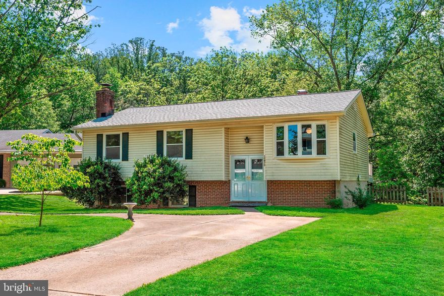 Beautiful split foyer nestled in the desirable Village of Harpers Choice. Adorned with freshly painted interiors, newly installed waterproof flooring and an exceptional open floor plan. Lovely kitchen highlighted with sleek cabinetry, breakfast bar, and a casual dining area with a sunbathed bay window. Entertain in the living and dining rooms boasting gorgeous hardwood flooring and deck access. Master bedroom highlights custom built-ins and an updated en suite bath. Two sizable bedrooms and a full bath conclude the masterfully designed main level. Travel downstairs to find an inviting family room complemented with a wood burning fireplace. A sizable laundry room with a work bench, a powder room, and walk-out patio access complete this well cared for home. After a long day, unwind and enjoy watching the sunset from the comfort of your welcoming deck and patio, overlooking a scenic view and fenced yard. Property updates include 2014- 2019: completely new roof, including decking, shingles, ridge vent, soffit vents, flashing, fascia, gutters, and extra insulation in attic, new water heater, front double door, storm doors, kitchen bay window, living room picture window, master bath vanity, sink, faucet, medicine cabinet, and lighting, and waterproof laminate flooring in the kitchen, foyer, and lower level. Don t miss out on this amazing opportunity!