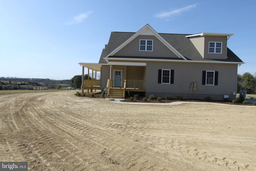 Newly constructed custom craftsman with main level master and  wrap-around porch on 2 acres. Craftsman details abound with custom built ins and window seats, gas fireplace with stone surround and box mantle, three-panel interior doors,  shaker kitchen cabinets with granite countertops and stainless appliances, tile showers, vaulted ceiling with spectacular, wide staircase with wood and iron railing, tons of natural light, French doors to rear porch, 2nd floor overlook, spacious bedrooms and closet spaces, private office, abundant storage opportunities in attic and full, unfinished basement, two car garage with additional area for work bench, storage or Gator parking.