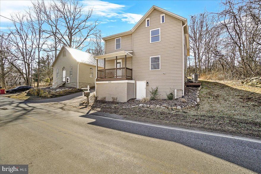 Charming Country Retreat with Bonus Historic Building!

Nestled along a peaceful rural road, this beautifully reimagined 2,900+ sq. ft. farmhouse seamlessly blends modern comforts with timeless character. Thoughtfully renovated with premium materials and expert craftsmanship, this home features UPGRADED ELECTRICAL, PLUMBING, HVAC and SEPTIC SYSTEM!

Step inside to discover an inviting main level designed for both comfort and functionality, boasting a spacious family room, cozy living area, elegant dining room, and a generously sized kitchen. A grand foyer and convenient laundry room complete this level. Upstairs, the luxurious primary suite offers a private sitting area, a walk-in closet, and exclusive access to a secluded balcony—perfect for morning coffee or evening relaxation. The walk-up attic provides additional storage while housing the A/C unit, and the dry walkout basement serves as an ideal storage solution.

Brimming with nostalgic charm, this home showcases vintage-inspired details and distinctive architectural elements throughout. The expansive backyard is a true retreat, offering complete privacy for outdoor gatherings, gardening, or quiet moments in nature.

But that's not all—this property  INCLUDES A BONUS 1,200SQFT DETACHED STRUCTURE! This versatile space, once a church, has been refreshed with paint and repairs while preserving its original wood floors, doors, and fixtures. Featuring solid glass windows, a new metal roof, and fresh exterior updates, it’s ready to be transformed into your dream space—whether an art or fitness studio, guest retreat, man cave, teen lounge, or creative workspace.

Spanning nearly an acre, this unique property offers the perfect balance of rural serenity and endless potential. Don’t miss this extraordinary opportunity to own a one-of-a-kind country escape!