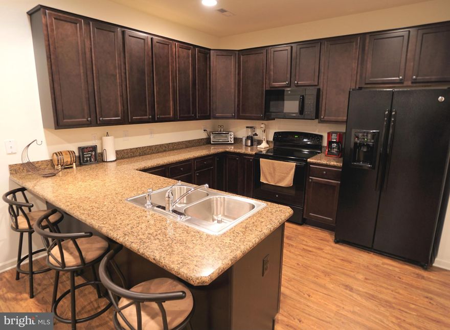 Own this beautiful like new home in sought after Spring Mills Community. Located at the end of the street, this end unit carriage home boasts a larger lot size and added privacy. Open floor plan on the main level. Master bedroom features a tray ceiling and master bath with soaking tub. Laundry conveniently on second level. Community pool, tennis courts, playground and close to shopping and food!