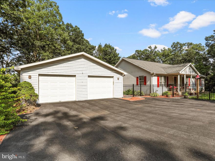 OFFER ACCEPTED.  NOW TAKING BACKUP OFFERS ONLY.         JUST OVER THE MORGAN COUNTY LINE AND OFF RT 9.  This expansive rancher sits about a quarter mile off the road in a tranquil forest setting on 2.18 acres. Featuring three ample sized bedrooms, and 3.5 bathrooms, sunny home office, a fully finished walk out/up basement with a pellet stove, pool table, game table and gun safe that convey and an oversized 3-car attached garage.  The detached one-car garage/shed  and circular driveway add even more convenience for multi-car buyers.  On the main level, in addition to the three bedrooms and 3 baths, a traditional floorplan provides a living room, eat-in kitchen with island and WALK-IN pantry, a breezeway home office, and laundry room.  SO MANY UPGRADES AND ADDITIONS!!!  2020 New roof, gutter guards, iron fencing, 2 new water heaters, detached garage, driveway repaved, well pump, plantation shutters and shades, whole home filtration system, installed 1/2 bath in basement and finished rest of basement.  2021 installed new carpet in basement and bedrooms.  2024 new HVAC system installed and is maintained every 6 months.  Stove, fridge, washer, dryer and dishwasher have all been replaced between 2021-2024.  Septic pumped  in February of this year.  This home is practically brand new.   Schedule your showing before its gone.