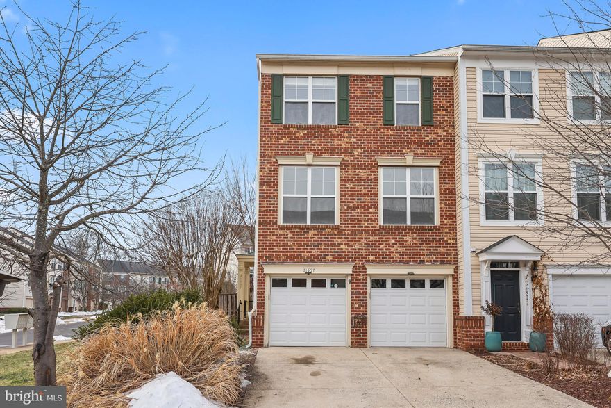 Welcome home to this beautifully upgraded 3-bedroom, 2 full and 2 half bathroom townhome in the highly desirable Broadlands community! This end unit, brick front townhome offers the perfect blend of style, comfort, and convenience.

Step inside to discover brand-new LVP flooring at upper two levels, fresh paint throughout, upgraded light fixtures, modern door hardware and updated bathrooms. The lower-level recreation room features a cozy fireplace — perfect for relaxing evenings or entertaining guests.

The main level offers an inviting layout with stainless steel appliances and seamless access to the spacious deck — ideal for morning coffee or outdoor dining. The patio below provides additional entertaining space and backs to an open common yard, offering privacy and peaceful views.

Upstairs, the primary suite impresses with a vaulted ceiling, ensuite bathroom, double sink vanity, and a beautifully updated walk-in shower. Two additional bedrooms provide flexibility for family, guests, or a home office.

Enjoy the convenience of a 2-car garage and an unbeatable location — just a 1-minute walk to the amazing kid-friendly community pool featuring water elements and beach-style entry.

Move-in ready and thoughtfully upgraded, this home truly checks all the boxes!