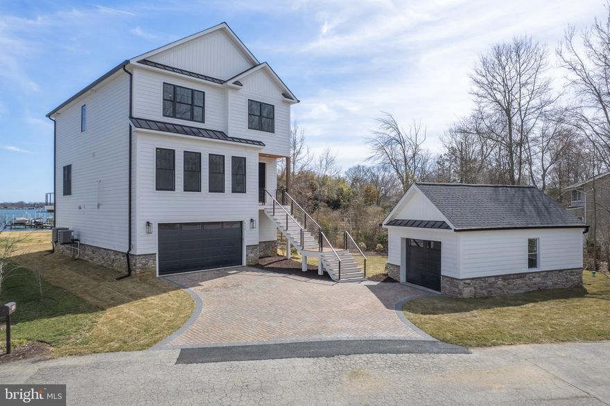 Introducing your dream waterfront oasis UNDER CONSTRUCTION NOW! At this moment there is still time to pick lighting.  Nestled on approximately half an acre of pristine land, this newly constructed gem boasts breathtaking views and luxurious living. With 4 bedrooms and 3 1/2 baths and a first-floor library, there's ample space for both relaxation and productivity.  Step into the heart of the home, where a large open kitchen awaits, adorned with stunning GE Cafe appliances and high end quartz countertops. Whip up culinary masterpieces on the 36" gas range with a professional hood and enjoy dinner and a summer breeze on your large deck overlooking Selby Bay!  Large, open floorplan with plenty of sunlit rooms!  Hardwood flooring is planned throughout the main living area! Indulge in unparalleled luxury with the owner's suite, a haven of comfort and style. Retreat to your own private oasis featuring a generous bath complete with a separate soaking tub and shower, as well as a double vanity for added convenience.  Step outside onto the second deck directly from the owner's suite, where tranquil water views and fresh breezes await, creating the perfect backdrop for morning coffee or evening stargazing.  Walk in closet with custom built-ins!  This exceptional property doesn't stop there - it also includes a jack and jill bedroom, ideal for families or guests, as well as another ensuite, ensuring everyone enjoys their own space and privacy.   Convenient 2-car garage plus an ADDITIONAL standalone GARAGE for all your storage needs or additional parking. Whether you're entertaining guests or enjoying quiet moments by the water, this property offers the perfect blend of elegance and functionality. Don't miss your chance to call this waterfront retreat home!  Pier permit!