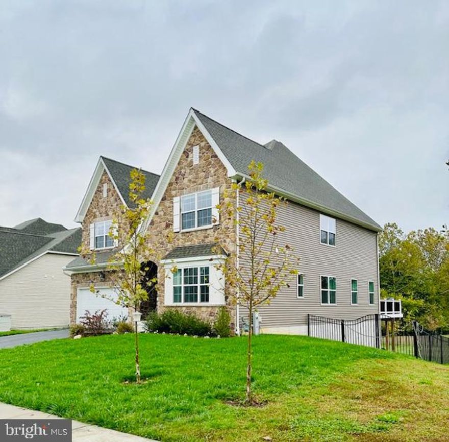 Price refinement on this two and half years young Eva Mar Farms home in Bel Air, Maryland built on a premium lot - it was one of last homes built and they DO SAVE THE BEST LOTS FOR LAST. This home offers an abundance of natural beauty with the backdrop looking over forest preserve land that guarantees privacy. Many updates after move in totaling over 90k include:  top of the line Lauzon solid hardwood floors installed on first and second levels, upgraded lighting, a 40 x 12 Wolf brand deck with full concrete patio underneath, a custom built pantry with ample cabinet space, and a black aluminum maintenance free fence surrounding the property.  The stunning top of the line chef's kitchen is complete with an elegant backsplash surrounding KitchenAid six burner gas stove and hood, double oven and white quartz countertops and all under the counter lighting and boasts an extra large island. The adjacent living room prides itself on entertaining - open access from the kitchen, large dining room, breakfast area and stunning serving nook with plenty of cabinets. There is a full bathroom on main level and also has a main level washer / dryer room with cabinets and utility sink sits just off the garage / mud room entrance  - perfect choice for kids or dogs.  Traveling upstairs on the extra wide 42 inch staircase is hard wood floor in an expansive bright loft area - there are four bedrooms. The primary comes with two huge closets - one with a window (could be an office). The second floor also hosts three additional bedrooms each with a walk in closet, a large shared full bath ideal for household members or guests. The unfinished basement has plenty of natural light, a rough in for a full bathroom and plenty of ways to design a finished living area. It has a walk out sliding glass door.  The two car garage has elevated ceilings and a cold and hot water hose bib - perfect for car or dog washing and utility sink ready for a dedicated work shop area.