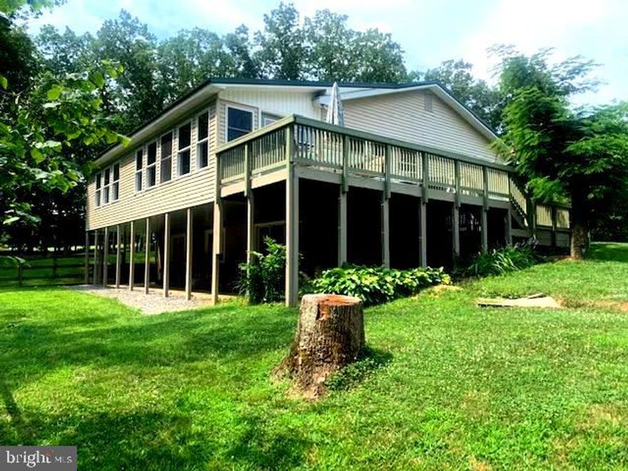 SECLUDED, SERENE, BEST OF THE EARTH GARDENING ON 19 UNRESTRICTED ACRES! NEW METAL BRIDGE INSTALLED ($30,000)  BY SELLERS, SPACIOUS FARM FIELD, FRONTING A STREAM.  MAIN LEVEL HAS LARGE COUNTRY KITCHEN W/ ATTACHED FAMILY ROOM.  ENCLOSED SEPARATE DINING AREA OVERLOOKING THE PARK-LIKESETTING IN THE BACK OF THE HOME. MASTER BDRM. BA.   EXTENSIVE FENCED GARDEN, FOR ALL TYPES OF VEGETABLES! OVERSIZED CUSTOM BUILT METAL BUILDING FOR EQUIPTMENT / STORAGE. FULL BASEMENT W/ 2 BEDRMS, BATH, CANNING RM.,  STORAGE AND CRAFT ROOM.  OUTDOOR WOOD FURNACE. ATTACHED GARAGE, CONVERTED.  WELL & SEPTIC. MUST SEE TO APPRECIATE!  BROADBAND INTERNET IS BEING INSTALLED!! LOCATED  WITHIN EASY DRIVE TO CUMBERLAND, MD, OR  TO WINCHESTER, VA.