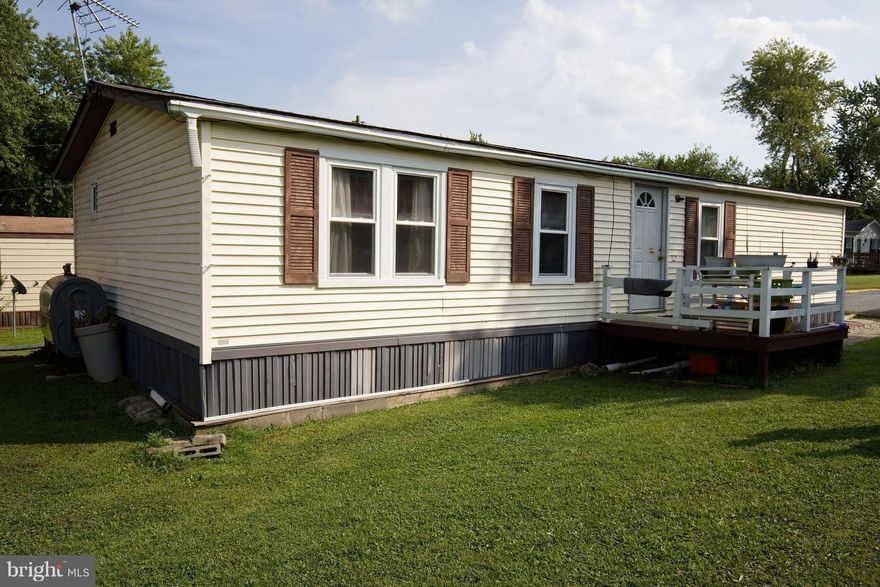 Great potential for this home in a private setting!  Large Kitchen & Dining area. High Vaulted ceilings. Separate den/office space off master bdrm. Large yard w/ great view!  New hot water heater/AC/Furnace.  Ground rent ($783 includes water/septic/trash removal/common area maintenance), Community Pond for fishing!  Application process is required by Pheasant Ridge Estates prior to purchase ($60).