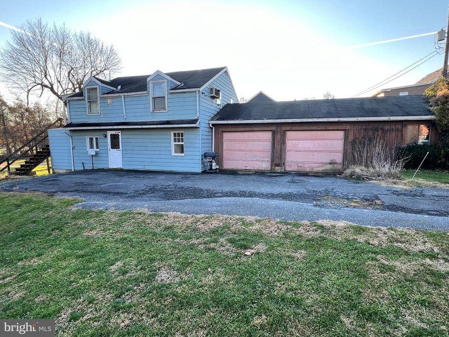 This property will be offered at Public Auction on Saturday, January 24, 2026 @ 10am.  The listing price is the opening bid only and in no way reflects the final sale price.  10% down due at auction, 2% transfer tax to be paid by the purchaser, real estate taxes prorated. This unique Millersville/Penn Manor home is set back off the road for added privacy and includes a spacious 2-car garage. The first floor features a large family room, a convenient powder room, office/utility room, and dedicated laundry area. The second floor offers a kitchen, living room, additional bathroom, one bedroom, and an open loft area. Additional amenities include attic storage, a large backyard, and convenient proximity to the Millersville community pool, Millersville University, and Route 999.