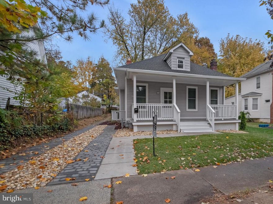 This beautifully reimagined 4-bedroom, 2-bath residence offers over 2,500 square feet of sophisticated  space, perfectly situated on a spacious, flat lot just a few blocks from the D.C. line.  From its crisp new exterior to every thoughtful interior detail, this home delivers a seamless blend of modern comfort and timeless style.  The grounds have been freshly regraded and are ready to be transformed into your personal outdoor oasis — with ample room for lush gardens, a serene patio, a cozy fire pit, or even a gazebo retreat.  Inside, the home impresses from the moment you step through the door. Every element has been renewed from the studs out — including a brand-new roof and gutters, insulation, siding, plumbing, electrical, drywall, doors, windows, and flooring. High ceilings and recessed lighting create a bright, airy feel throughout the main level, which features three spacious bedrooms and two beautifully renovated full baths.  The chef’s kitchen is a true showpiece, boasting soft-close cabinetry, sleek quartz countertops, new stainless steel appliances, and a thoughtful layout that combines functionality with style — ideal for both everyday living and entertaining.   Downstairs, the lower level with an exterior side entrance offers endless possibilities — whether you envision an elegant guest suite, a media lounge, or a refined home office.  The newly installed paver driveway provides parking for at least three cars, complementing the home’s fresh exterior and impeccable curb appeal.  Enjoy the confidence and peace of mind that comes with a complete renovation — every system, surface, and finish brand new —quiet and peaceful yet all within minutes of shopping, public transportation, commuter routes, and places of worship.  Make this perfect balance of luxury, comfort, and location your home — a home designed to elevate every aspect of daily living.  Generous seller is willing to work with buyers.
