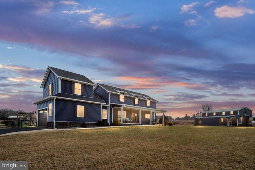 Resort living w/ beautiful water views of the Potomac River! Custom 2019 4BR/3.5BA home showcases 14' cathedral ceiling in LR/DR w/ fireplace flanked by built ins, open concept flow, dormers and two 8' double doors w/ transoms to a sprawling lanai w/ 3 fans, wet bar rough in and TV setup. Kitchen: quartz
countertops, KitchenAid appl, farm and prep sinks, walk in pantry, oversized island w/ microwave drawer
and hidden outlets, custom range hood, glass display uppers, pull out spice racks. Luxe primary suite w/
tray ceiling, big WIC, direct pool access; 2 person shower w/ rainfall, dual vanities, lighted jet tub w/ built-in radio. Two lg BRs share a jack-jill bath; upstairs BR/bonus w/ full bath—ideal theater/office. 10' kitchen
ceiling, 9' elsewhere; new Renewal by Andersen front door w/ side transoms, tankless WH, septic-safe
disposal, 400A service. Attached 2-car garage plus a climate controlled 30x40 detached garage (14' walls,
reinforced slab for lift, dedicated 200A service, 8x8 and 10x10 roll ups, 50amp hookup for your camper)-a
dream shop/studio. Heated saltwater pool w/ tanning ledge and benches, pool closet; extra chemicals/equipment conveys. 1.25 acre lot, neighborhood dock access/boat ramp, NO HOA FEES! Broad
front porch w/ 2 fans. High end finishes, indoor outdoor flow. Select items may be negotiable with the right
offer. 3,036 SF of finished living space; 727 SF lanai; 320 SF porch; 572 SF attached garage; 1100 SF detached garage w/ 100 SF porch.