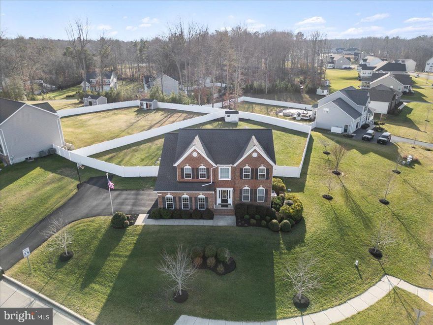 Another chance to get into Prince Frederick’s coveted neighborhood, Oakland Hall! This is a prime location in the community – located near the mailboxes, the playing field, the largest playground in the community, a short drive to the front of the neighborhood and sidewalks with curbing, right on your lot.  This stunning brick front home is an eye catcher as soon as you enter Oakland Hall and it doesn’t stop there! The “Preston” floorplan is one of a kind and only offered one time in Oakland Hall! The inviting, 2-story entry brings in a ton of natural light to the home, showcasing the hardwood floors. This unique floor plan offers a designated living room and dining room, breakfast table space and a great room for your everyday use.  The “grand” kitchen comes complete with a tile backsplash, tons of soft-close cabinetry with a pantry cabinet, a S.S. double oven, and a glimpse through your casement window into your flat backyard! The backyard has been fully fenced in with a white, privacy fence. Ideal for nights in the hot tub that is included in the sale! Also included is a gorgeous, newly installed patio and covered gazebo to set the mood! Upstairs you will find the owners suite of your dreams!! Complete with the biggest walk-in closet, WITH a closet system already installed, a “grand” bathroom with double sinks, an oversized shower and soaking tub and plenty of room for your “King” sized bed in the bedroom. Upstairs is complete with a total of 4 bedrooms, a laundry ROOM, and 2 fully tiled bathrooms. The basement is great for all things but is currently being used as an additional office space, a workout area (great with those 9ft ceilings) and a theater room. This theater room with a sliding barn door is complete with everything you will need for the perfect movie night! Just bring the popcorn. Community amenities include a pool, multiple playgrounds, a clubhouse, street lighting, sidewalks and the neighborly feel that you have been longing for. Make Bunker Hill Court your next move!