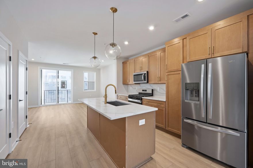 Prime Location, Exceptional Living! Commonwealth Place offers the perfect blend of convenience and charm, just a short stroll to shopping, dining, and entertainment at the Westfield Shopping Center. Located off Route 28, this community provides easy access to major commuter routes, making travel a breeze. The Fernand Woodbury takes the concept of location to a whole new level. Enjoy front-facing views of the community’s lush green space, plus the added bonus of being steps away from popular destinations like Wegmans, Chipotle, Peet’s Coffee, and much more! This thoughtfully designed condo features a private two-car garage and a stunning center kitchen equipped with sleek stainless steel Whirlpool appliances, elegant quartz countertops, modern wood-toned cabinets, and sophisticated gold accents. With a wealth of carefully curated upgrades and finishes, this home is ready to be transformed into the living space of your dreams. Move-in ready this Spring—this is an opportunity you won’t want to miss. Call sales today to schedule your appointment and make this beautiful condo yours!