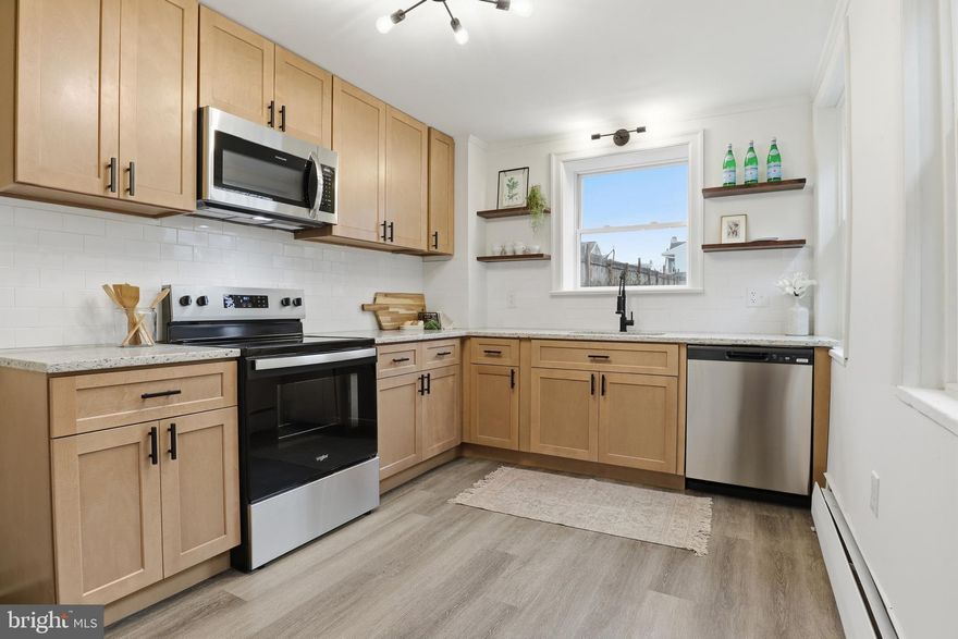 NEW YEAR, NEW PRICE!! Fully renovated end-unit home located in a quiet, spacious neighborhood in Columbia. This move-in-ready property features a bright and welcoming main level, a beautifully updated kitchen, and modern finishes throughout. Enjoy three bedrooms, second-floor laundry, and a finished third-floor bonus room perfect for an office, playroom, or extra living space. Major upgrades include an updated 200-amp electrical panel and new air conditioning, giving buyers added peace of mind and year-round comfort. Outside, the home offers a large backyard ideal for entertaining or relaxing. With its modern updates, generous layout, and peaceful setting, this turnkey home is ready for its next owner. Listing Agent is co-owner of property.