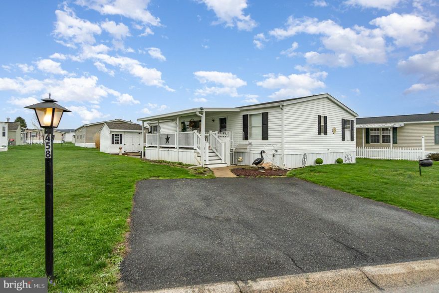 Welcome to this well-maintained 3-bedroom, 2-bathroom double wide located in the popular Sunset Estates community. This sought-after park offers an exceptional lifestyle with fantastic amenities included in the land rent, trash pickup twice a week, basic cable through Comcast, and access to the beautiful community in-ground pool.
Step onto the spacious, covered front porch made from low-maintenance composite decking, perfect for enjoying your morning coffee or relaxing in the evenings. Inside, you'll find a bright and welcoming living space with brand new carpet in both the kitchen and living room, adding a fresh and cozy feel throughout.  The large kitchen offers plenty of cabinet and counter space, ideal for cooking, baking, and entertaining. Stay comfortable year-round with central air conditioning and enjoy peace of mind knowing the roof was replaced in 2022. Whether you're looking to downsize or just starting out, this home offers comfort, convenience, and a warm community atmosphere. Don't miss your chance to make Sunset Estates your next home!