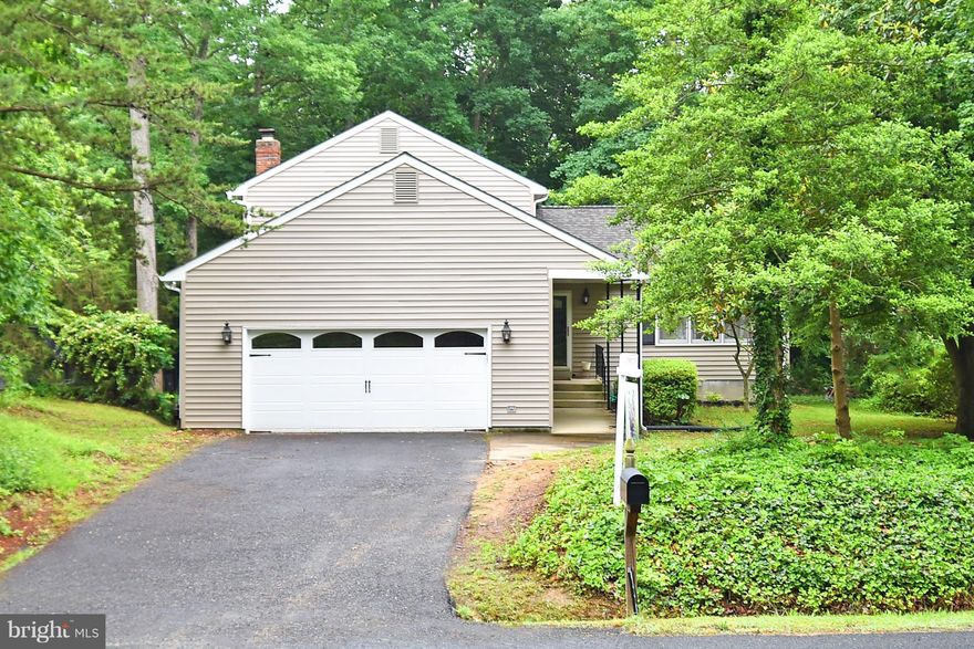 THREE LEVEL HOME FEATURING AN AWESOME LOCATION TO 95 JUST OFF 610 TUCKED AWAY ON A TREE LOT, 2 DECKS, 2 CAR GARAGE, HUGE FAMILY ROOM WITH BRICK FIREPLACE, EAT IN KITCHEN, DINING AREA WITH WOOD FLOORING, REMODELED BATHROOMS, NEW ROOF, SIDING, GUTTERS (2017), GARAGE DOOR , AND GARAGE DOOR OPENER. THIS IS A GREAT HOME WITH LOTS OF PRIVACY