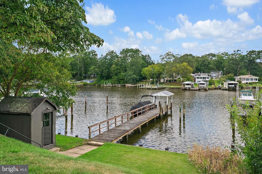 Welcome to your waterfront getaway! This cozy modern cottage offers the perfect blend of charm and relaxation with breathtaking sunset views right from your living room. Enjoy direct access to the Magothy River with your own private pier—ideal for boating, crabbing, fishing, kayaking, or simply soaking in the beauty of the Chesapeake lifestyle. Inside, you’ll find a comfortable, light-filled living space with an open layout, 3 rooms upstairs, 2 bedrooms and 1 flex space, 2 full bathrooms, and updated touches that make it easy to settle in. This home delivers peaceful waterfront living at its finest. Don’t miss your chance to experience boating, sunsets, and life on the water every day! As a resident of Manhattan Beach, you’ll enjoy additional access to community events, clubhouse, three private beaches, boat ramp and a brand-new playground.