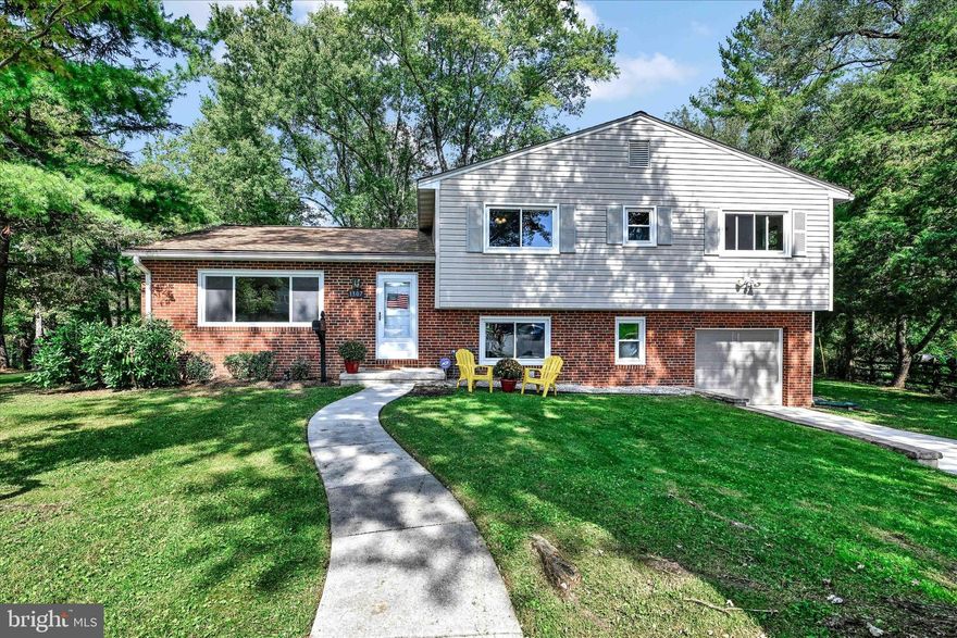 Immerse yourself in the charm of this beautifully renovated split-level residence, boasting 4/5 bedrooms and 2.5 baths, nestled on an expansive acre in the coveted Waterford Neighborhood. Situated just moments from Towson's vibrant shopping and dining scene, with effortless access to I-695. This home is enveloped by a tranquil wooded lot.

Once  inside, you’ll find the inviting living room seamlessly connected to the separate dining area, offering a delightful view of the kitchen. Enter the remodeled kitchen, featuring contemporary countertops, refreshed lighting fixtures, and brand-new flooring.  Lustrous hardwood floors grace the living room, dining room and bedrooms.

Descending to the lower level, you’ll discover a welcoming three-season room adjacent to the family room with luxury vinyl flooring, where a cozy pellet wood stove adds to the ambiance. Additionally, this level houses a versatile 5th bedroom or office space with a powder room for added convenience.

Upstairs, the primary bedroom boasts its own fully updated en-suite bathroom. Three  bedrooms and a full hall bath round out the upper level. Each bathroom in the home has been  updated to enhance both functionality and aesthetics.
Peacefully tucked away in a cul-de-sac, this residence has seen numerous enhancements, including a 2016 roof replacement, 2020 new A/C and  replacement windows, a newly installed patio in 2021, and fresh flooring throughout in 2023. For a comprehensive list of improvements, please refer to the associated documents. The seller's dedication ensures this home is move-in ready, allowing you to embark on worry-free living.
