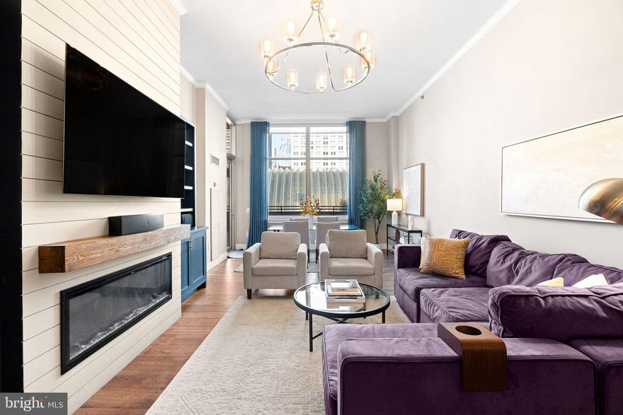 A rare find - one of only three private residences on the coveted amenities floor of the Symphony House, this exclusive unit features unparalleled private outdoor space with skyline views.
This one of a kind residence is a must see to believe. Tastefully renovated with designer-selected finishes, this home is warm and inviting, and sun-splashed with natural light. This oversized floor plan with soaring high ceilings is generously proportioned, offering nearly 1,000 square feet of living space. An open chef's kitchen with a full suite of stainless steel appliances and quartz counter tops, complementing warm cherry cabinetry, flows effortlessly into an open dining area, allowing entertaining with ease. The living room easily accommodates large furniture sets in a number of combinations with ease, and features a custom entertainment center with built-ins and fireplace. Oversized windows provide incredible views of downtown. Off the living and dining room area, find a beautifully renovated full bath with spa-like walk-in glass shower, vanity, and an incredibly spacious linen closet. Find your own in unit laundry in a separate hall closet, in additional to a pantry storage closet. A fantastic amount of closets for a one bedroom. Enter into the bedroom with soaring ceilings, a huge walk in closet, and window bench seating. A truly standout feature of this unit is it's private patio, which offers an additional 500 square feet of living space outdoors. Overlooking the stunning neighboring arch of the Kimmel Center, you are immersed in the skyline--you can see the Eagles parade down Broad Street from your own terrace!
This unit also features it's own covered parking space in the attached garage with interior access, and a generously sized private storage unit on the building's storage floor.
The building's 8th floor features only three select units, with their own private, secured entry, as it is home to all of the luxurious amenities the building has to offer, including: fitness center, library, lounge and meeting room, catering and hosting facilities, and the beautiful indoor swimming pool and sauna with its two outside north and south facing sun decks. The incredibly well maintained building features 24 hour doorman/security and has top-rated resident satisfaction.