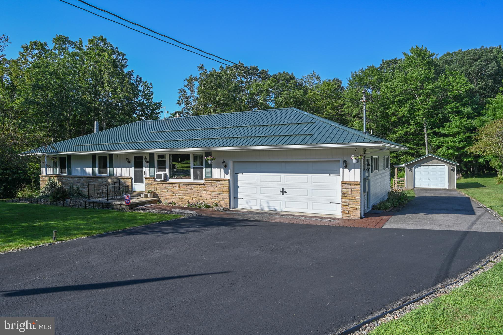 New Price – Now $360,000!
Beautifully Updated Mountain Retreat Near Deep Creek Lake
Here’s your chance to own a move-in-ready mountain retreat with major upgrades—now offered at just $360,000! Located only 10 miles from Deep Creek Lake and minutes to Oakland, this 3-bedroom, 2-bath home sits on nearly an acre and blends small-town convenience with peaceful mountain living.
Step inside to a smart single-level layout featuring an updated kitchen with granite countertops, custom cabinetry, and quality appliances. Both bathrooms have been tastefully renovated, and the home shines with refinished hardwood floors, crown molding, new ceiling fans, and a cozy electric fireplace.
The finished basement adds real value with flexible space for a gym, bar, kitchenette, reading nook—whatever fits your lifestyle.
Outside, you'll find even more to love:
New metal roof and exterior paint
Upgraded sidewalks, storm windows, and exterior lighting
Large back deck with winter barriers, privacy curtains, 7-person hot tub, and weatherproof smart TV
Paved driveway with both attached and detached garages, plus two storage sheds
Whole-house generator hookup for peace of mind
Enjoy extras like raised garden beds, a fire pit, cleared yard space, and even a chicken coop ready to go. City water is connected and a new hot water tank is already installed.
This home offers exceptional value, thoughtful upgrades, and a serene setting—all at a new, lower price. Whether you're seeking a full-time residence or a weekend escape, this one checks all the boxes.
Don’t miss this incredible opportunity!