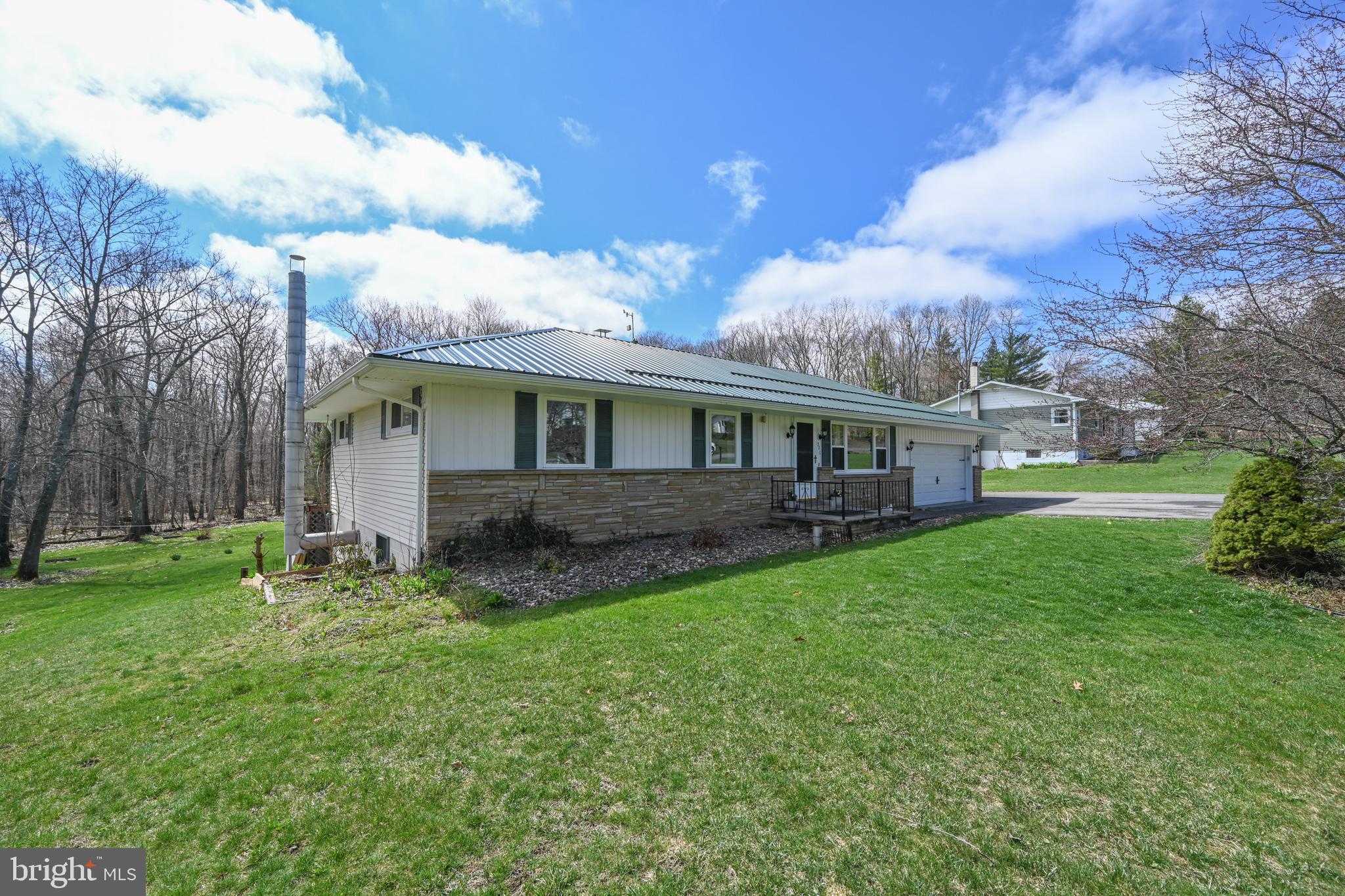 New Price – Now $360,000!
Beautifully Updated Mountain Retreat Near Deep Creek Lake
Here’s your chance to own a move-in-ready mountain retreat with major upgrades—now offered at just $360,000! Located only 10 miles from Deep Creek Lake and minutes to Oakland, this 3-bedroom, 2-bath home sits on nearly an acre and blends small-town convenience with peaceful mountain living.
Step inside to a smart single-level layout featuring an updated kitchen with granite countertops, custom cabinetry, and quality appliances. Both bathrooms have been tastefully renovated, and the home shines with refinished hardwood floors, crown molding, new ceiling fans, and a cozy electric fireplace.
The finished basement adds real value with flexible space for a gym, bar, kitchenette, reading nook—whatever fits your lifestyle.
Outside, you'll find even more to love:
New metal roof and exterior paint
Upgraded sidewalks, storm windows, and exterior lighting
Large back deck with winter barriers, privacy curtains, 7-person hot tub, and weatherproof smart TV
Paved driveway with both attached and detached garages, plus two storage sheds
Whole-house generator hookup for peace of mind
Enjoy extras like raised garden beds, a fire pit, cleared yard space, and even a chicken coop ready to go. City water is connected and a new hot water tank is already installed.
This home offers exceptional value, thoughtful upgrades, and a serene setting—all at a new, lower price. Whether you're seeking a full-time residence or a weekend escape, this one checks all the boxes.
Don’t miss this incredible opportunity!