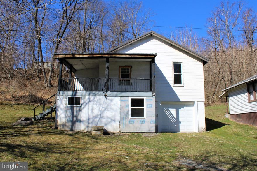 A DIAMOND WAITING TO BE FINISHED - THIS HOME NEEDS MAJOR RENOVATIONS BUT FEATURES A NEW METAL ROOF - NEW 200 AMP SERVICE ELECTRIC PANEL - NEW GARAGE DOOR WITH REMOTES - NEW REPLACEMENT WINDOWS - WALKING DISTANCE TO   POPULAR FISHING AREA  KNOWN AS WILLS CREEK-  YOU  CAN SIT ON THE 29X11 WRAPAROUND PORCH AND WATCH THE SCENIC WESTERN MARYLAND TRAIN AS IT ROLLS BY OR ENJOY THE GREAT ALLEGHENY BIKE TRAIL - THERE IS A VERY NICE LOT WITH THIS  HOME  - JUST BRING YOUR HAMMER AND SOME GOOD IMAGINATION.  FEATURES 2 BEDROOMS AND A SMALL DEN AREA.
