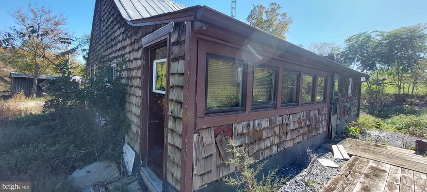Located in the beautiful Hardy County, WV countryside, this rustic 2-bedroom cabin offers a perfect canvas for those with a vision. Featuring wood floors that speak to its timeless character, this property invites you to bring your ideas and creativity to breathe new life into it. Sitting on just over 3 acres of unrestricted land, the property includes partial fencing and a substantial barn, ideal for kickstarting your homestead dreams. This rural gem is a fantastic investment opportunity, promising great rewards for those willing to put in the effort. Whether you're looking to create a small retreat or a productive farmette, this property has the potential to become your perfect rural haven.  This is an AS-IS - CASH ONLY PROPERTY.  Utilities will not be turned on!