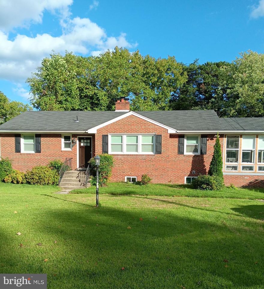 Welcome to this lovely 5 bedroom home with 3 full bathrooms with plenty of space to spread out for relaxation or entertainment.  (3 bedrooms main level / 2 bedrooms lower level)  The home is very spacious with just under 2,700 total sq ft nestled on a large lot. Upon entering the large living room you will notice the gleaming wood floors that continue throughout the main level.  There are several recent updates to the home, including a new sump pump, a sewer ejector system, sunroom windows, and stylish bathroom tiles.  Enjoy the comfort of a full basement and cozy up to a wood-burning fireplace in the recreation area.  There is ample space in the basement for a wet bar or a 2nd kitchen.  Features: a sun porch; a large backyard with trees lined against the fence for privacy; off-street /driveway parking to accommodate 5 cars and much more!  Motivated Seller    (Seller credit may be available)   AS-IS Sale  **Must See**