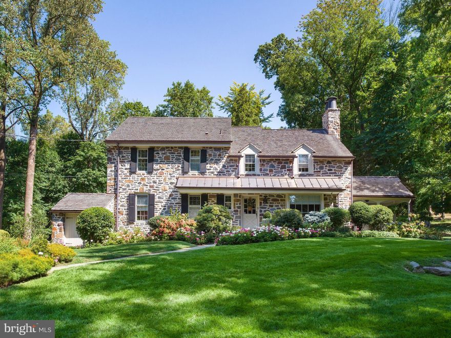 Enter a home of timeless elegance and unparalleled charm with this exquisite stone colonial, perfectly situated on the scenic, country-like stretch of Mount Pleasant Road. This 4-bedroom, 3 full, and 2 half-bath masterpiece is in the Pennsylvania farmhouse style, where historic character meets modern luxury. From the moment you arrive, you'll be captivated by the home’s stately presence and serene surroundings. The expansive grounds, lush with meticulously maintained gardens and a tranquil Japanese fishpond, provide a perfect backdrop for this one-of-a-kind residence. Here, every detail has been thoughtfully curated to offer an unparalleled living experience, making it a rare gem on the Main Line.

The main level welcomes you with a bright, open-concept family room that flows seamlessly into the kitchen, flanked by a sun-filled breakfast room and a den. The living room, featuring a large window bench, is a peaceful retreat for bird watching or reading, with doors that open to a covered porch—perfect for hosting friends or enjoying a quiet evening. The dining room, with its own French doors leading to the patio, provides an elegant space for gatherings.

Upstairs, the primary bedroom suite is a serene escape, complete with a Juliet balcony overlooking the lush, private backyard. The additional bedrooms are equally inviting, each with unique views of the surrounding greenery, enhancing the home's natural connection. The third-floor suite adds versatility as a guest room, a teen's private retreat, or a home office. This space, like the rest of the house, has been meticulously updated, including new windows, new plaster and paint, and a rebuilt septic and drip system.

The lower level is finished with fitness and recreation areas, a powder room and laundry, and 2-car garage.

Outside, the expansive flagstone patio, which has been completely re-seated, and beautifully maintained gardens invite you to unwind amidst nature. The property also boasts a recently renovated Japanese fishpond with a working waterfall, adding to the tranquil ambiance. Extensive landscaping has introduced a new grass clearing to the backyard and lined the driveway with forsythia, river birch, and butterfly bushes.

The home has recently undergone numerous thoughtful upgrades, ensuring both functionality and aesthetics. These include a 3/4" jumbo cedar roof with 50-year protection, 20-gauge copper flashing on the front pent, valleys, and rear dormer, European 6” 20oz copper gutters with oversized downspouts, and Velux triple laminate skylights in the sunroom, and a state-of-the-art Bosche HVAC system with 3 zones has just been installed. The chimney has been repointed and flashed with copper, and new chimney toppers with rain hats have been installed. All downspouts lead to new underground storm laterals utilizing ‘schedule 40’ PVC pipes that daylight far from the building footprint in the pachysandra. A 20kw generator, new security system with surveillance cameras, high-grade mechanicals, replaced storm windows, newer septic and sump pump with battery backup will ensure your comfort and peace of mind at all times. The property by also features a new electrical sub-distribution panel, majority Lutron Decora outlets and switches, Panasonic exhaust fans with copper roof vents in all baths and upgraded gas service capacity with the meter moved outside the home. The driveway has been resealed, and significant tree work has been done to enhance the property’s natural beauty.

This Villanova gem offers a unique opportunity to live in a home where every detail has been carefully considered, combining the charm of a classic fieldstone colonial with the comforts of modern living. It’s more than just a house—it’s a place to create memories, enjoy nature, and live life to the fullest.