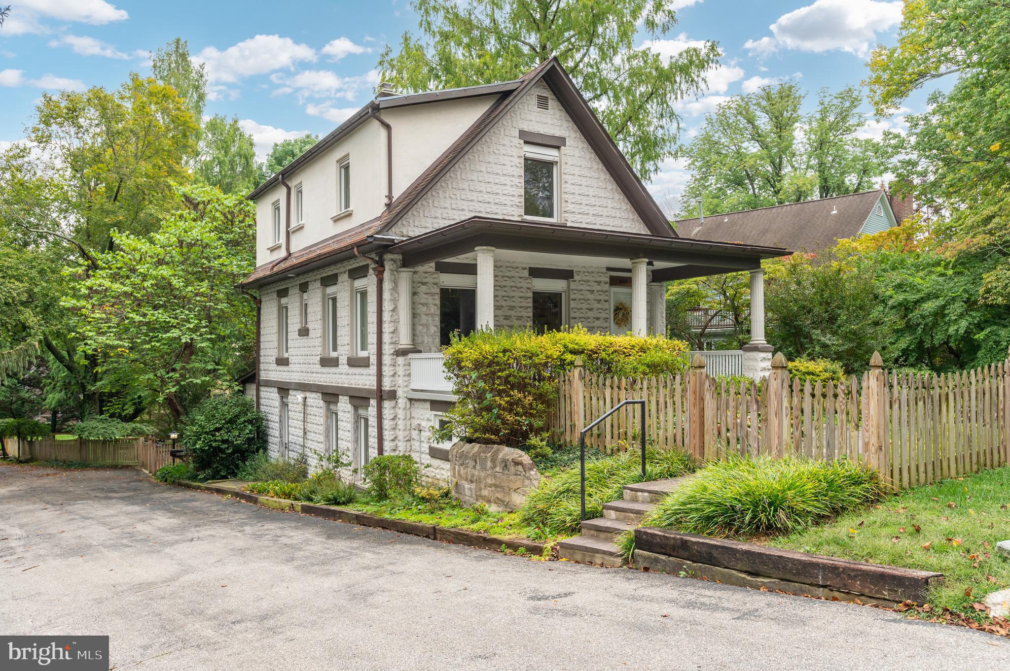 Set on a lush, tree-filled lot of over 14,000 sq ft in the coveted North Chevy Chase community, this classic stone farmhouse has been masterfully renovated to blend timeless architecture with modern comfort. Backing directly to Rock Creek Park, the home offers a rare combination of privacy, history, and convenience, just steps to trails, schools, and shops.
Inside, three expansive levels of light-filled living space are surrounded by green views on every side. Thoughtfully preserved and upgraded, the home features original heart-of-pine and hardwood flooring, exposed beams, oversized custom European windows, and stunning remodeled kitchens and baths with high-end finishes.
The chef’s kitchen was fully updated last year, including white oak cabinets, quartz counters, handmade tile backsplash, professional 6-burner gas stove, exposed beams, and adjacent mudroom/hall closet. Full new lower level third bath added, along with an adorable powder room off the kitchen/dining area. The dining room has full-height glass and wood built-ins, and a large historic brick chimney with a Vermont Mansfield wood stove insert for cozy winter nights.
The top level has a master bedroom and spacious second bedroom with sunny exposures on two sides and views of the sequoia trees, a remodeled master bath with European fixtures and custom shower, and newly installed laundry space for easy access. The middle level has an additional two light-filled bedrooms and remodeled bath, alongside a large living room with original built-in fireplace.
There are plenty of extras both outdoors and in -- such as stone patios, gazebo with lights, wood picket fences, California Closets, Shade Store automatic blinds, new large washer/dryer, all new Lumens designer lighting throughout. New systems (double-zoned Daikin HVAC and Navien tankless water heater) also make it maintenance free for years to come. Existing hot-water radiators provide continuous radiant heat. Covered country porches in both front and back, and landscaped bucolic front, side and backyard are a gardener’s dream. Perennials abound – including peonies, irises, tulips, daffodils, and butterfly bushes – along with two Dawn Redwoods planted in the late 1940s. A bit of history -- the original owner was a florist, botanist and pioneer of the hybrid snapdragon, and the property and surrounding land was filled with greenhouses.
The newly created detached guesthouse and/or office provides a separate private space with independent heating/cooling, electrical and WiFi systems. Consider hosting guests, having a home office, artist’s studio or entertainment space in this park-like setting. The vaulted ceiling, exposed beams, glass doors and windows on all four sides that flood the space with light and green, all making this versatile space an architectural gem and refuge.
The property is steps from Rock Creek Park Trail, Woodend Sanctuary (Audubon) and Mansion, and walking distance to the North Chevy Chase Swim Club, North Chevy Chase Elementary School and the new Chevy Chase Lake retail development including new grocery, restaurants and shops. Inside the BCC high school district. Easy access to the almost completed purple-line Metro station on Connecticut Ave less than a mile away (expected to be finished by late 2026). For the buyer seeking a natural park-like retreat near urban amenities, authentic solid craftsmanship with abundant updates, this is a unique opportunity!
The square footage three above ground levels is more than the public record. We will have a floor plan soon and professional pictures.
A rare opportunity to own a historic yet fully updated home on parkland—ideal for buyers seeking authentic craftsmanship, lush outdoor spaces, and modern convenience in a walkable community.