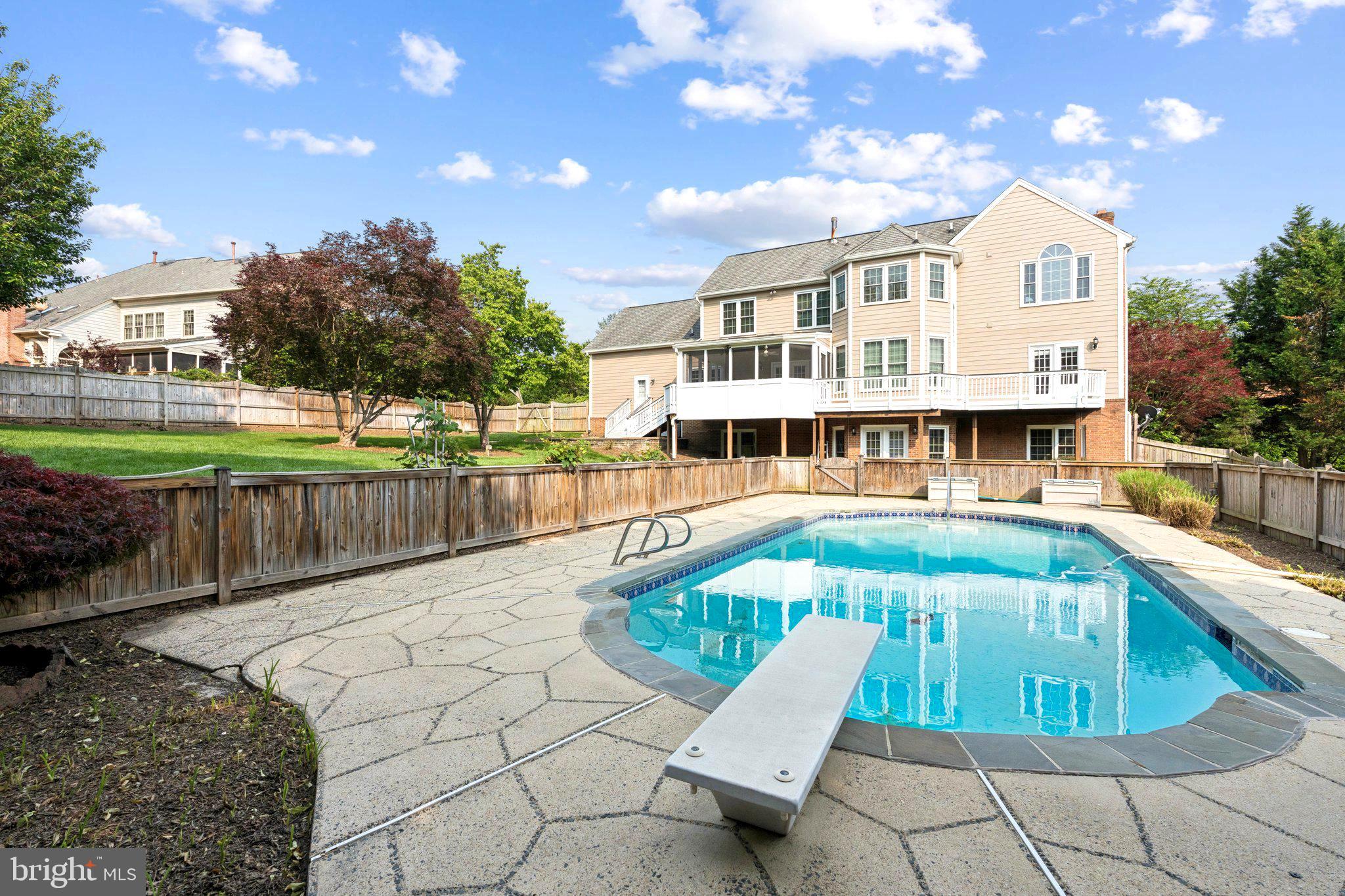 Situated in prestigious Middleton neighborhood of Vienna, this refined residence lies within the highly sought-after Colvin Run/Cooper/Langley pyramid. Positioned on a premium corner lot, the property is surrounded by nature and features a built-in pool with a diving board, for relaxation and entertaining. From the moment you step into the grand foyer, with its staircase and gleaming floors accented by marble, the exudes timeless elegance. Constructed all-brick materials and enhanced-end upgrades this seamlessly combines sophistication and durability expansive living, and rooms offer perfect spaces for hosting, while the kitchen serves as a true focal point, boasting top-of-the-line appliances, a large island, and meticulously crafted cabinetry. Additional conveniences include a spacious pantry, a-appointed room, a three -car sideload garage ample storage space at the of the is the great room, featuring a wood burning fireplace, skylights, and picturesque views of nature. A private main-level office with French doors opens to elegant outdoor Throughout the home, neutral decor, intricate crown molding and hardwood further enhance its charm.
The upper level is anchored by luxurious owner’s suite, complete with vaulted ceilings a private sitting room, and an extraordinary-designed walk-in closet. The spa-inspired updated bathroom includes granite countertops, a vanity, Jacuzzi tub, and a separate. Three generously sized secondary bedrooms and with a private and a bath for the other two bedrooms. The walk-out lower level designed for, featuring a spacious recreation, a full kitchen, an additional bedroom, a fully updated bathroom.