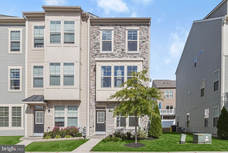 Discover a remarkable end-unit, 3-level townhome that's been thoughtfully upgraded, nestled in the vibrant resort-style community of Tanyard Cove North. This water-access community offers a clubhouse with a refreshing pool and fitness room, a picturesque patio featuring an outdoor fireplace and grilling station, a playground, dog park, a marina for boating enthusiasts, convenient canoe/kayak racks, and a charming picnic pavilion for outdoor gatherings. Inside the home you'll find design inspired, upgraded tile, cabinet and bathroom hardware, and lighting fixtures at every turn. The open concept layout seamlessly connects the kitchen, living room, and dining room, with gleaming hardwood flooring, large windows that flood the space with natural light, and a sliding glass door that leads to a private deck. The kitchen is a culinary dream with granite counters, 42-inch cabinets, a unique vertical glass tile backsplash, an island that provides functionality and style, pantry, and stainless steel appliances, including a double oven gas range. Upgraded cabinet hardware and industrial-style lighting fixtures adorn the kitchen and adjacent dining room. The living room offers a cozy ambiance with its gas fireplace, creating the perfect setting for relaxation and entertainment. An updated powder room with white stone accent wall concludes this level. On the upper level, the primary bedroom awaits with a double closet and an en-suite bath featuring a double vanity and a custom shower with tile reminiscent of faraway places. An additional bedroom suite with a full bath and a convenient laundry room complete the upper level. The entry level provides flexibility, offering a third bedroom that can also serve as a home office, as well as a freshly painted family room with a sliding glass door leading to the newly fenced backyard. The attic has been recently floored ensuring ample storage space is available. This home is the epitome of modern living within a dynamic and amenity-rich community. Welcome home!