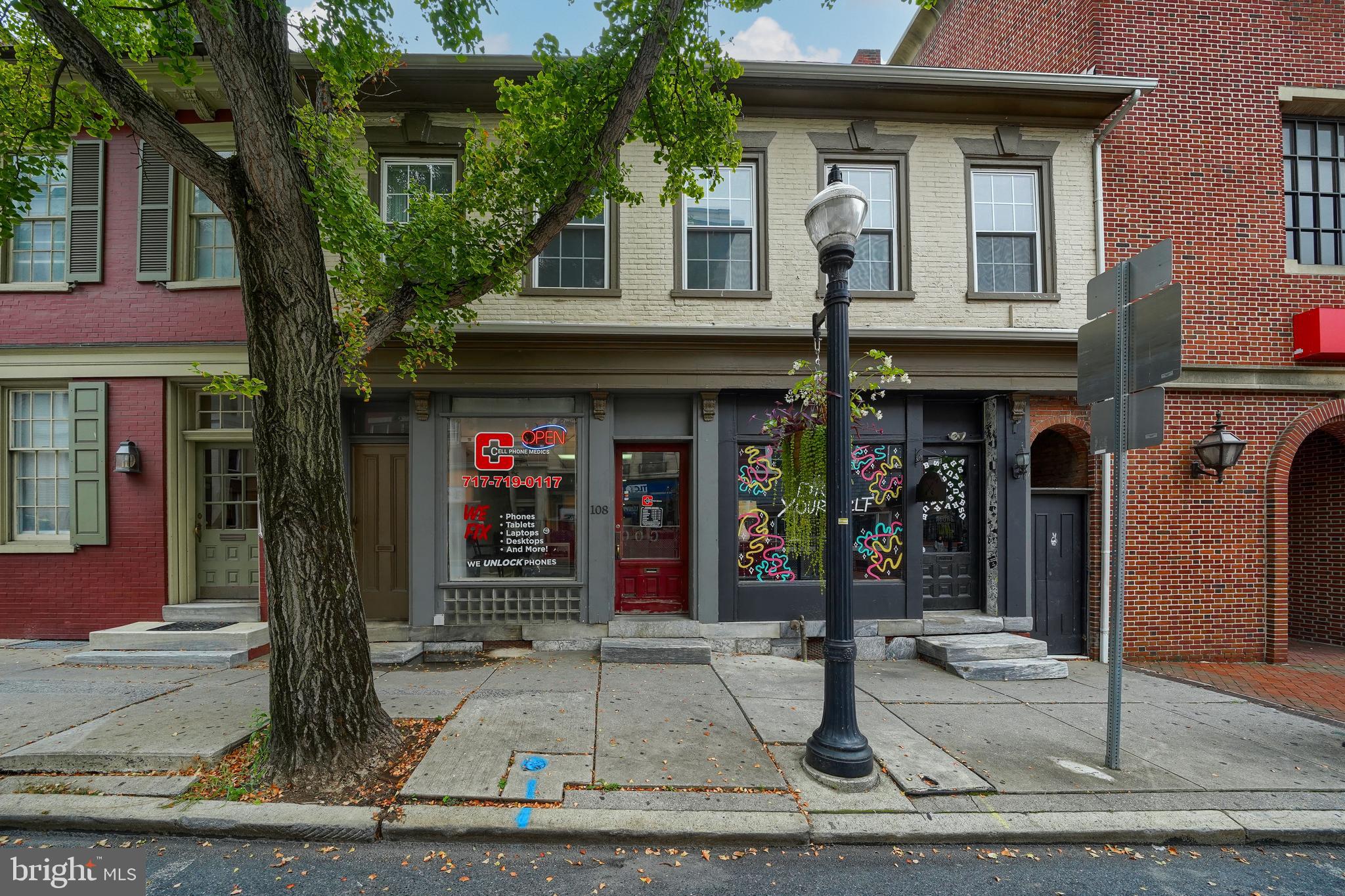 Welcome to 106-108 E. King Street! This historic commercial property is located in the heart of downtown Lancaster, directly across from the Lancaster County Courthouse and just a short walk to Annie Bailey’s. Built in the 1700s, the building is solid, full of character, and brimming with potential. It features two tenant-occupied storefronts (approximately 1,300 SF and 900 SF), a vacant back room overlooking the private courtyard, and a 1,300± SF office space on the second floor that could potentially be converted into an apartment with city approval. Being sold as-is, this rare property is ready for your finishing touches to make it your own. With its blend of history, charm, and income potential, it is a unique investment opportunity in Lancaster City’s thriving core. Showings Begin 8/21!