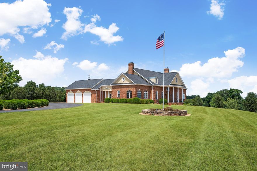 BEAUTIFUL BRICK ESTATE ON 42+ ACRES IN WINCHESTER!! This luxurious brick colonial is located just minutes outside of Winchester City. Boasting 4 bed rooms 4.5 bathrooms across three finished levels, totaling just over 7,700+ square feet. The heart of  the home is the chef's kitchen. Which conveys top of the line appliances, granite countertops, and plenty of custom cherry cabinets.  The main floor supplies one level living with an over sized primary suite and primary bathroom with his and her closets! The living room has ample natural lighting with scenic views of the county, which leads into the custom theatre room!! Home Theater Room conveys Klipsch surround sound system including Dolby Atmos in-ceiling speakers,  a Denon 4k capable A/V receiver, plus a 4K UHD Sony Projector displaying on a 120" screen. The Upstairs you'll find 2 bedrooms connected with a Jack and Jill bath, another bedroom with an attached bath, an office (equipped with high speed Xfinity internet wired throughout the home), 2 spacious storage rooms, and bonus play. Going down to the basement you'll find a granite wet bar, additional full bath and Rec Room/Family Room/Work Out Room, the options are endless!  Walking out from the basement is a heated salt water swimming pool, featuring 3 water falls and full color LED lighting while provided with panoramic views and outdoor speakers! ( Whole home is equipped with a blue tooth speaker system). For your security needs, the home has a monitored alarm system with interior motion and door sensors and is surrounded with an exterior 4k camera system. Also, protecting the driveway is 2 power entrance gates. All three levels of the home are climate controlled as well as the three car garage by 4 zone HVAC.  New roof in 2024!!  All of the luxurious amenities this home has to offer is also supplied with 42.42 acres and three additional buildings!! Electric underground dog fence to help contain your pets!  There are several paddocks throughout the land all separated and surrounded with three board fence. The 5 car detached garage is (72X32), Horse barn is (60X38) has a full bath and is equipped with a wash stall and automatic water in every stall. There's an automatic water feature in the pasture as well. House, Barn and Horse Stables, all on dedicated electric service.