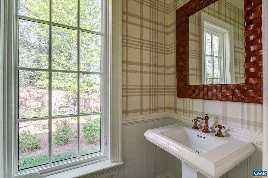 If it is in Charlottesville, Virginia, who doesn't love a classic, Flemish Bond brick, copper & slate Georgian located on one of the city's most beautiful, quiet residential streets yet in walking distance to Downtown, the University & Barracks Road shopping & conveniences? This incredibly well constructed & true period home dates to the 1930's, like its distinguished neighbors. Look forward to entertaining guests in the graciously proportioned living spaces & preparing family meals in the new, Karen Turner-designed kitchen & oversized butler's pantry. The current owners undertook significant renovations & an expansion w/ revered Shelter & Associates. The interiors now feature that new kitchen & butler's pantry w/ Gaston & Wyatt carpentry plus new primary & powder room baths. Further, they improved the home w/ a stunning mudroom & half bath wing designed by Bethany Puopolo. From the brick terrace & bluestone patios that wrap the back of the home, envision watching family & friends practice their sports on the private, level, back lawn. Architectural highlights incl' 4 working fireplaces inside as well as 1 outside for social gatherings, high ceilings, mellowed-with-age hardwood floors & a stunning staircase w/ curving banister.,Marble Counter,Painted Cabinets,Wood Cabinets,Fireplace in Dining Room,Fireplace in Family Room,Fireplace in Living Room,Fireplace in Sun Room