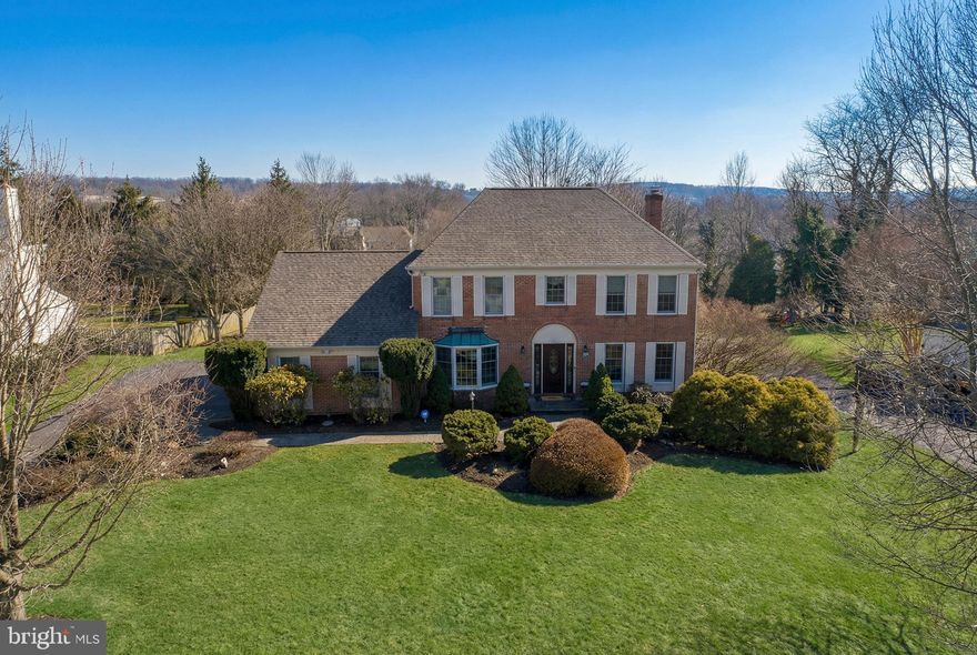 Tucked away on a coveted cul-de-sac in the highly regarded Dublin Hunt community, 711 Signal Hill Rd offers classic brick-front Colonial charm, meaningful upgrades, and exceptional living space on .51 private acres. With 4 bedrooms, 3.5 baths, and 2,987 sq ft plus an additional approximately 680 sq ft in the finished basement, this Dresher home is designed for both everyday comfort and effortless entertaining.

A welcoming foyer with hardwood floors and crown molding sets the tone, leading to beautifully defined formal and casual spaces. The gourmet eat-in kitchen is a true centerpiece, featuring granite countertops, stainless steel appliances, a cooktop with custom hood, wall oven and microwave, recessed lighting, and a spacious center island with seating, all complemented by luxury vinyl plank flooring. Just beyond, the sunlit breakfast room impresses with vaulted ceilings, exposed beams, new skylight, wainscoting, and a slider that opens to the backyard and large paver patio, creating an ideal indoor-outdoor connection.

The main level continues with a spacious family room offering hardwood floors, fresh paint, recessed lighting, built-ins, and a cozy brick fireplace. The living room adds flexibility and style with hardwood floors, chair rail, crown molding, and French doors to the family room. The formal dining room provides an elegant setting and ample space to entertain with hardwood floors, chair rail, crown molding, and a charming bumped-out window seat. A convenient first-floor laundry room/mudroom includes a cubby area, washer and dryer, and plenty of built-ins for extra storage and shelving space.

Upstairs, the primary bedroom en-suite is a standout with luxury vinyl plank flooring, recessed lighting, two ceiling fans, two walk-in closets (one is massive!), and a dedicated mini-split. The updated primary bath features a glass-enclosed shower, granite-topped vanity, and custom tilework. Three additional bedrooms offer new carpet, ceiling fans, and ample closet space. The finished basement expands the home’s versatility with a full bath and an optional 5th bedroom or media room, plenty of recreation space, plus an unfinished storage area.

Notable improvements include a new roof (11/2025), newer skylight (2025), newer A/C (2023), water heater (2020), and new carpeting (2026). Conveniently located near the Promenade at Upper Dublin featuring shops like Sprouts Market, HomeGoods, and Starbucks. Close proximity to both Mondauk and Aidenn Lair parks, Esporta and Lifetime fitness centers, and the dining and entertainment scenes of Ambler and the Glenside/Keswick area. Easy access to the PA Turnpike, routes 152, 611, 309 and 63, as well as nearby Fort Washington and Ambler train stations. Schedule your private showing and experience the space, setting, and lifestyle this home delivers!