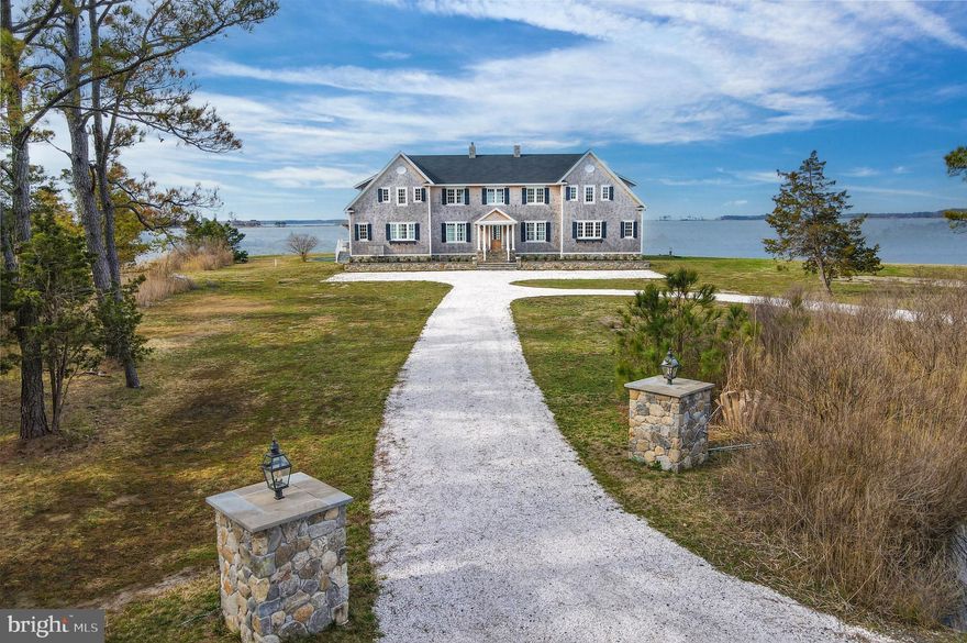 Set on a 2.38 acre peninsula with 1,100 feet of waterfrontage, 1301 Broadview Drive is a thoughtfully crafted waterfront retreat defined by exceptional materials, timeless detail, and water views from every room. The exterior pairs stone and cedar shingles with copper lanterns and bluestone hardscaping for a classic Eastern Shore look, while inside, custom millwork, mahogany accents, brass floor registers, and a refined mix of designer fixtures and finishes create a warm and elevated feel throughout.

The main level is designed for both everyday living and effortless entertaining, centered around an open gourmet kitchen with Shaw fireclay sinks, Waterworks fixtures, marble counters and backsplash, a mahogany island, and a fully integrated appliance suite. A beautifully finished butler’s pantry, breakfast area with custom bench seating, and great room with custom built ins and a gas fireplace with marble surround add both style and function. A dining room, library or office with built ins, powder room, mudroom, and laundry room complete the main level, while the covered deck provides the perfect place to take in the sunset.

Upstairs, the private spaces are equally inviting, highlighted by a serene primary suite with a large walk-in closet, private deck, and a spacious marble bath with soaking tub and custom shower. Additional bedrooms offer custom closets, designer lighting, and beautifully finished baths, while a gym and rear upper deck add to the home’s comfort and flexibility. Outside, sweeping views stretch across the Chesapeake Bay, Little Choptank River, and Fishing Creek, with a waterside pool, pier with lift, boat ramp, and detached storage garage completing this exceptional property. Modern conveniences including Nest climate control, security cameras, fiber wiring in most rooms, and smartphone-controlled dimmers add ease to a home where craftsmanship, comfort, and waterfront living come together beautifully.