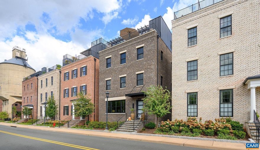 Located within a few blocks of the Downtown Mall, Belmont and Midtown,  this sophisticated 3 bed, 3 full plus 2 half bath home offers the best of Charlottesville?s downtown lifestyle.  The owners have cared for and improved the home tirelessly since they bought it new in 2019.  All three bedrooms are ensuite, including the luxurious master suite, which takes up an entire floor.  The dramatic rooftop terrace with gas fire pit offers city and mountain views in all directions.  2 garage parking spaces plus plenty of guest parking. Other features include a gas fireplace in the living/dining/kitchen area, deck off the kitchen and many built-ins the owners added post completion of the home.,Quartz Counter,Exterior Fireplace,Fireplace in Living Room