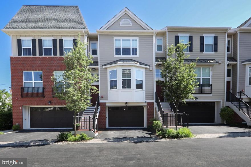 Experience elevated, low-maintenance living on the Main Line in this exceptional, walkable Bryn Mawr location within the highly desirable Danley community. This elegant 3-bedroom, 3.5-bath townhome is perfectly positioned in the center of Bryn Mawr, just moments from vibrant downtown shops, restaurants, entertainment, SEPTA regional rail (Paoli-Thorndale Line), and Bryn Mawr Hospital.

Filled with natural light, the home offers a thoughtfully designed open layout highlighted by custom millwork and refined architectural details throughout. Designed for both comfort and convenience, the floor plan provides functional living spaces along with the option for a future private elevator.

The main level features a timeless white kitchen complete with stainless steel appliances, upgraded countertops, generous cabinetry, and ample storage—ideal for entertaining or everyday living. The adjoining living and dining areas showcase hardwood flooring, a gas fireplace, and access to one of two private balconies for seamless indoor-outdoor living.

Upstairs, the spacious primary suite serves as a relaxing retreat with dual closets and a beautifully appointed bath featuring a double vanity, large tiled shower, and linen storage. A second bedroom, full hall bath, and convenient laundry area complete this level.

The top floor offers an oversized third bedroom with its own full bath and private deck—perfect as a guest suite, home office, or quiet sanctuary.

The finished lower level provides additional flexible living space ideal for a media room, gym, or remote work setup, with direct access to the attached garage for added ease.

With two private balconies, abundant closet space, and an unbeatable walkable location near Bryn Mawr Hospital, downtown amenities, and regional rail, this home delivers sophisticated townhome living in the heart of the Main Line.