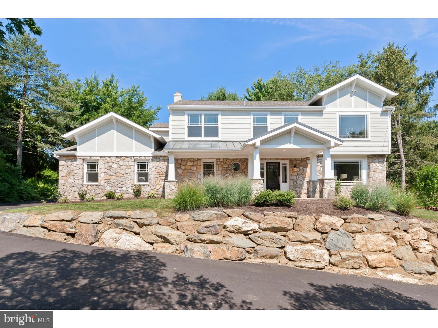 Totally renovated in 2017, this 4 Bedroom stone colonial has been meticulously transformed by a large Family Room addition, Marvin windows throughout and natural hardwood flooring into a spacious home for family fun or gracious entertaining. Natural light and beautiful views are just part of the experience. The large Foyer offers a coat closet and Powder Room with wainscoting. To your right is a dramatic Dining Room space complete with a wood burning fireplace and windows overlooking the valley. This opens to both a spacious Family Room with gas fireplace detailed with tile work to the ceiling and windows overlooking the spacious rear grounds; and the Gourmet Eat-in Kitchen with custom Poggen Pohl cabinetry, large center island with quartz countertop, farmhouse porcelain sink, Thermador commercial cook top, Wolf Micro Wave/Convention and wall oven, double door Fisher & Paykel refrigerator with freezer drawer,lighted cabinets with glass doors, and lots of counter space. The Family Room opens out to a wood deck and stone patio for summertime cooking, dining or reading a book. Off the kitchen is the Den, also with wood burning fireplace which could serve as an office, or a small space just to hang out. The Laundry Room/Mud Room, also on this level, offers lots of build-ins for coats, boots, entry to the two car garage and an exit to the driveway. There's also a sink that could easily accommodate your small dog at bath time. The staircase to the 2nd floor has been detailed with glass panels to continue the "openess" theme of the house. The Master Bedroom, with coffered ceiling, more beautiful views and lots of light, has a walk-in closet, and a beautiful white marble bathroom with soaking tub, frameless tiled shower and double sinks with custom cabinetry. The second Bedroom offers it's own bathroom also with a large frameless shower and sink with cabinetry. There are 2 additional bedrooms on this floor and the third full Bath. This hall Bathroom has subway tiles, double sinks with marble counter top and cabinets, a tub and linen closet. The lower level has also been finished with wood flooring. LED recessed lighting throughout. New central air. There is a new roof and Hardie Board siding. New Septic System and regrading and landscaping of the driveway. Mature plantings define the rear yard. Nothing has been missed in refurbishing this home. And now it can be yours. Suburban living at its finest, and yet a quick ride to Philadelphia culture.