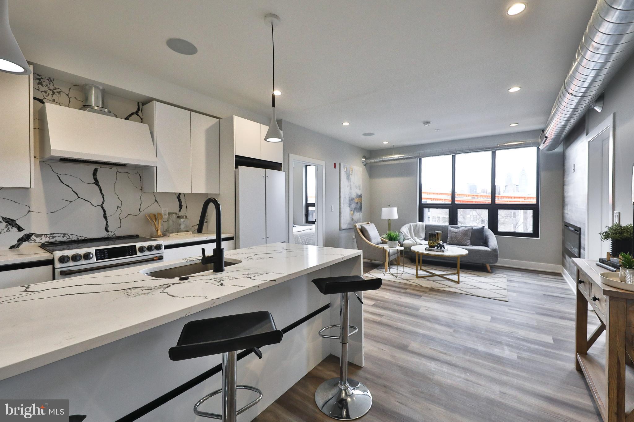A 21 unit luxury condominium building. Sixteen Twelve features top-of-the-line GE Café appliance packages, custom kitchen cabinetry, LED lighting throughout, Gerber bath and kitchen fixtures, modern European bath finishes and tile, beautifully designed casework, and accents. In addition, the property will feature a building-wide automation and state-of-the-art access control system with security monitoring and surveillance for peace of mind. Residents will enjoy a modern building with many amenities commonly found in downtown hi-rise buildings. The elevator will take you from your unit to a well-appointed rooftop with panoramic city views perfect for relaxing or entertaining. Every residence comes with the use of your own private storage room in the cellar, which will also be serviced by the elevator. Also, 21 secured and covered garage parking spaces. Feature: HVAC: Central Air – Goodman Equipment; Air Handler 1.5-2Ton 14 SEER Heat Pump, 5KW Programmable smart thermostat, 40 gallon water heater, KBE 70mm European tilt and turn windows Low-E/Argon, Prewired for cable internet: Comcast and Verizon will be available, Secure Entrance with Elevator Access, Fully Furnished common area Green Roof deck equipped with pedestal porcelain pavers. Individual secure storage lockers for each unit in the basement, bike storage, Stunning Center City Views, Walking distance to Fairmount and Center City, INTERIOR 9’ ceilings, Unique trim through-out, Fireplace in each unit, 7 mm Durato V-EVO XL Luxury Vinyl Plank flooring, Quartz countertops, LED recessed lights and kitchen pendants, GE Front Load Washer/Dryer, Gerber/Danze bath and kitchen faucets, GE Café/Monogram kitchen appliances: Refrigerator, Dishwasher, Range, and Hood. Stainless steel under-mount sink. Garage Parking available for $200/mo. Tenant pays $40.00/mo for water and $10.00/Mo technology fee + Electricity and Internet. **Advertised Rental Rate is for and 18 Month lease with 1 Month Free Spread out monthly over the term of the lease.